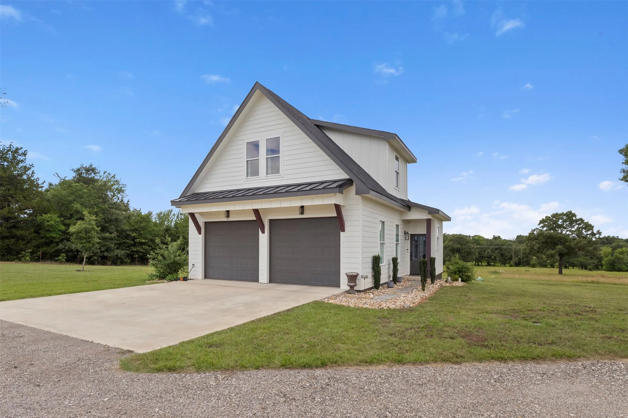 Luxury detached auxiliary unit offering 650 sq. ft. of private living space above the workshop, complete with a full bath, kitchenette, and balcony—ideal for guest accommodations, extended stays, a private office, or flexible additional living space.