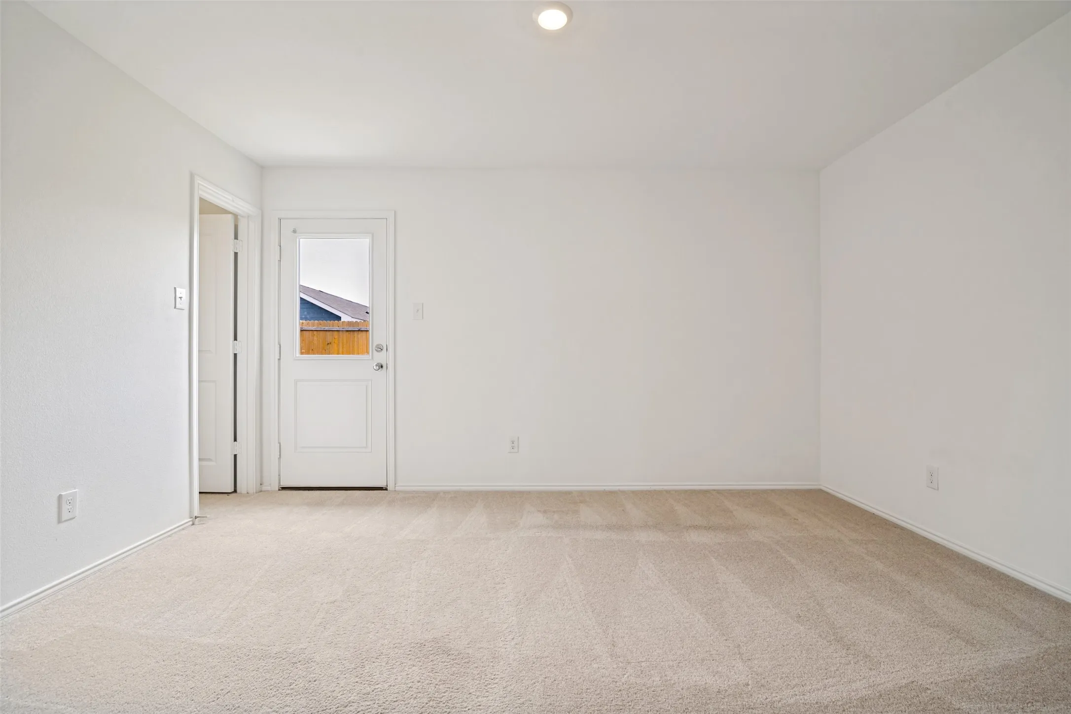 Neutral toned carpeting throughout