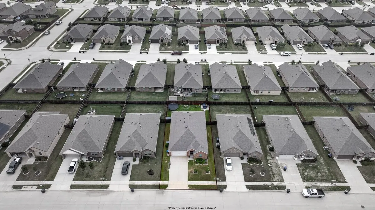 Aerial perspective showcasing a residential community with uniform architectural styles
