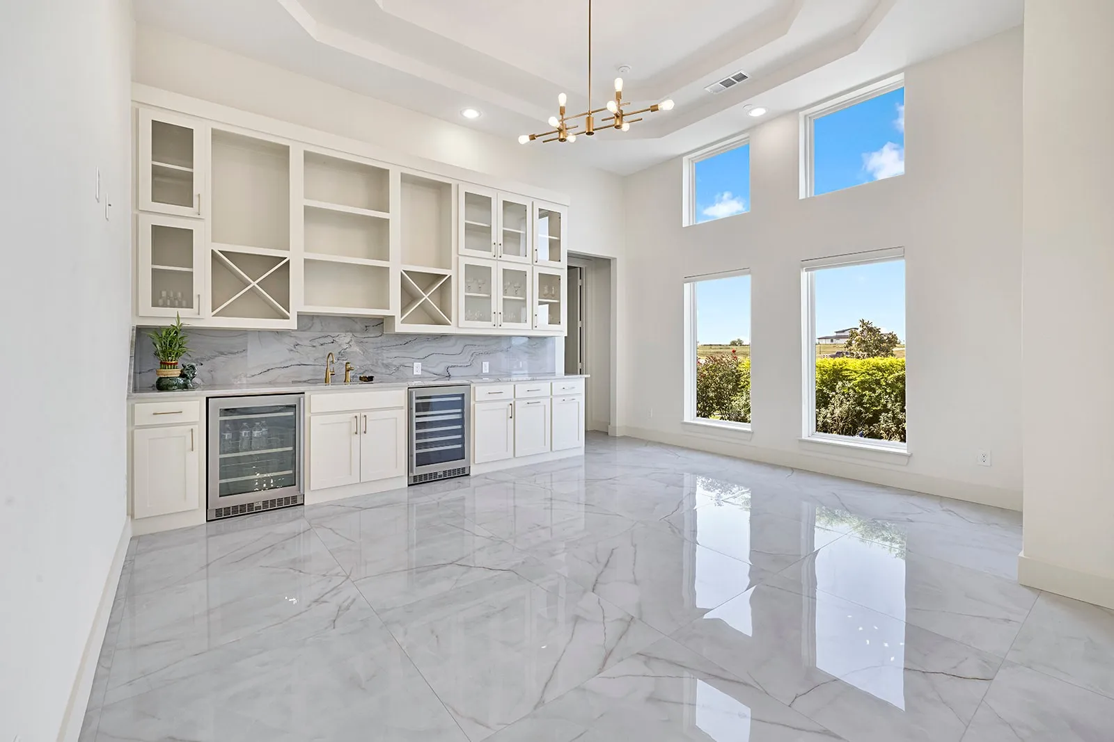 Spacious interior with high ceilings and white walls