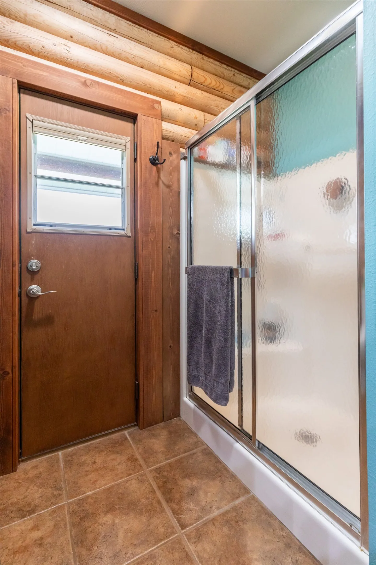 Primary ensuite shower with convenient door to the back porch. Hot tub anyone?
