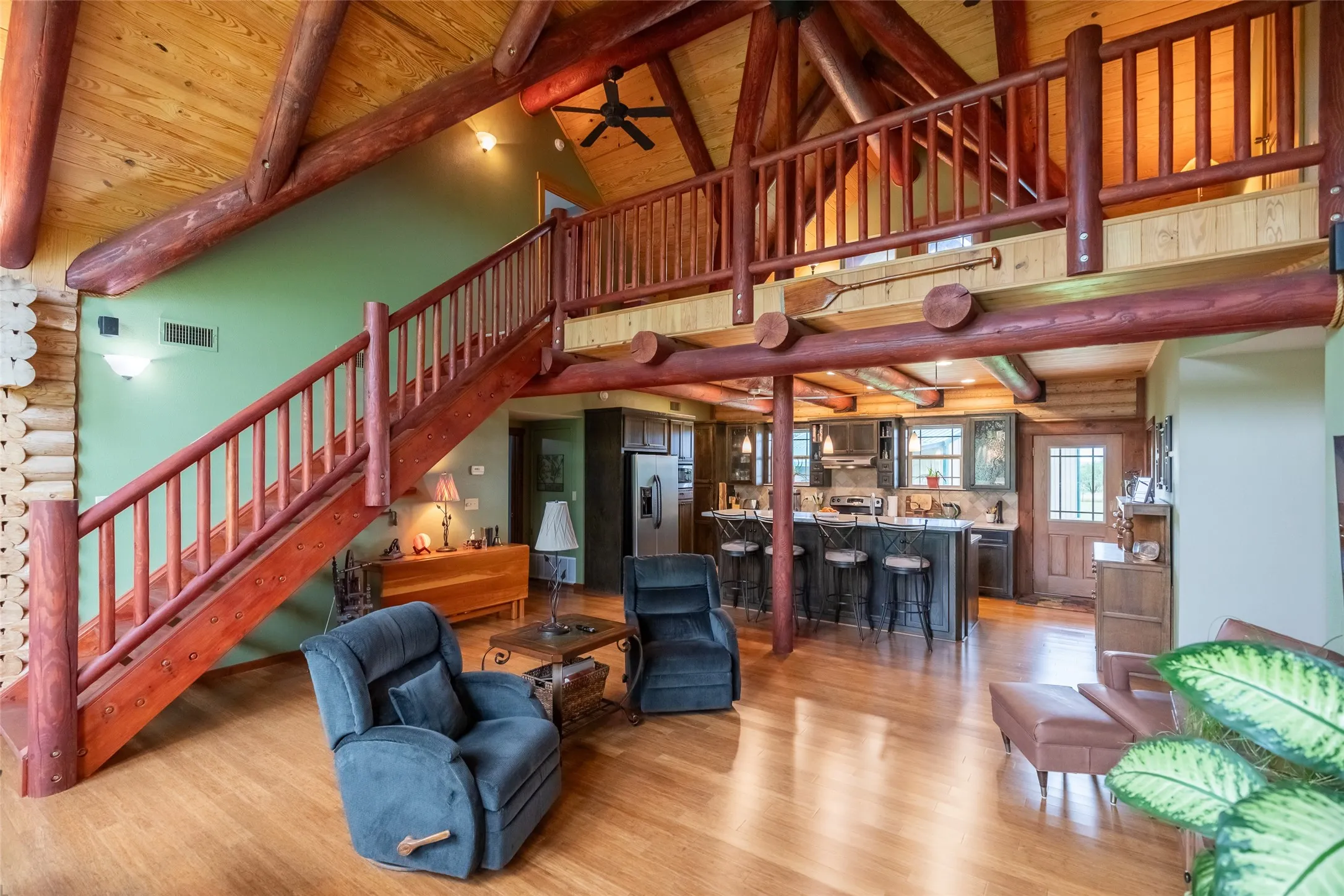 Hand crafted staircase to the loft and third bedroom. Open concept and ample space for entertaining or relaxing.

