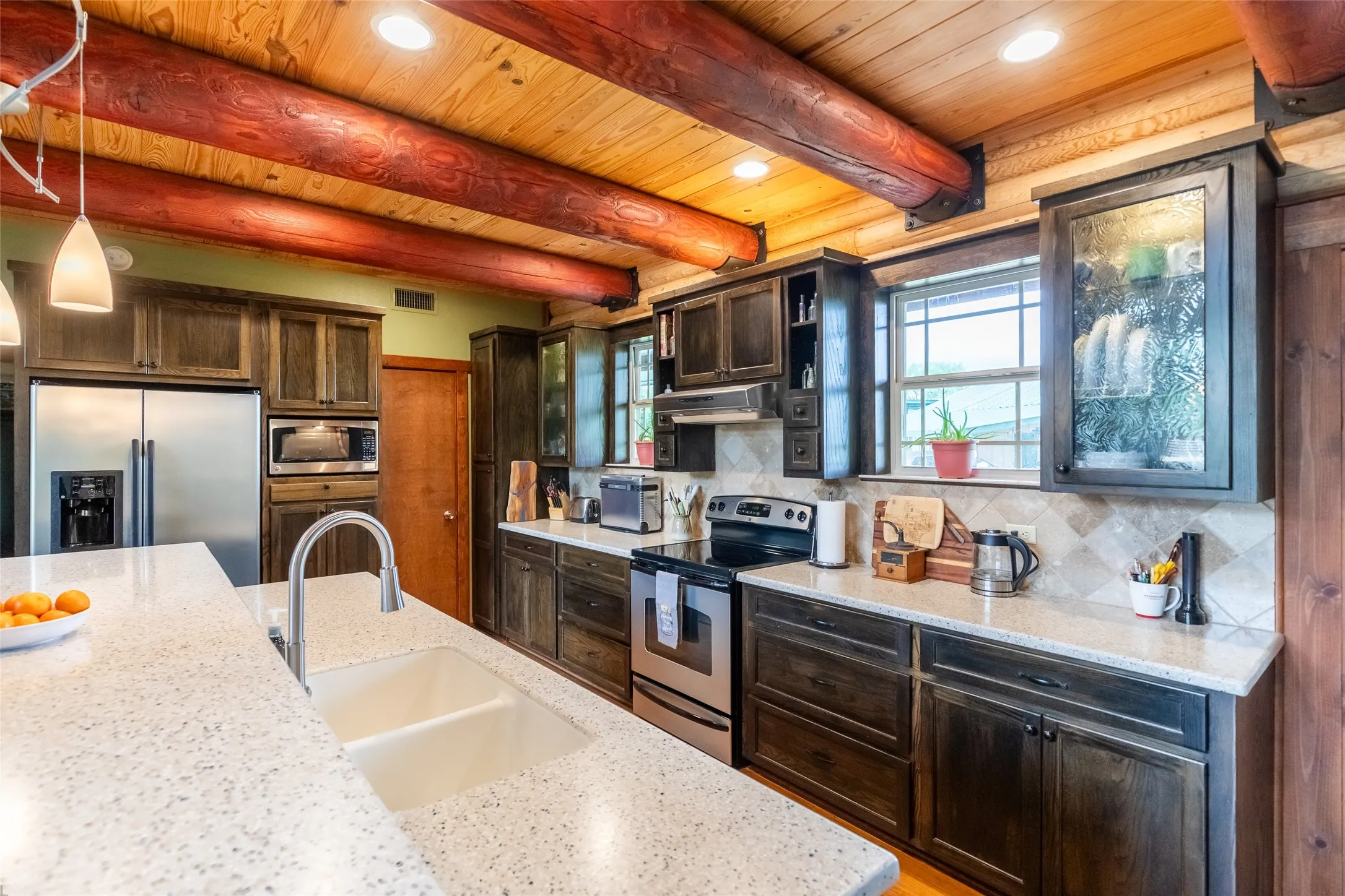 Hand stained cabinets also have interior lighting