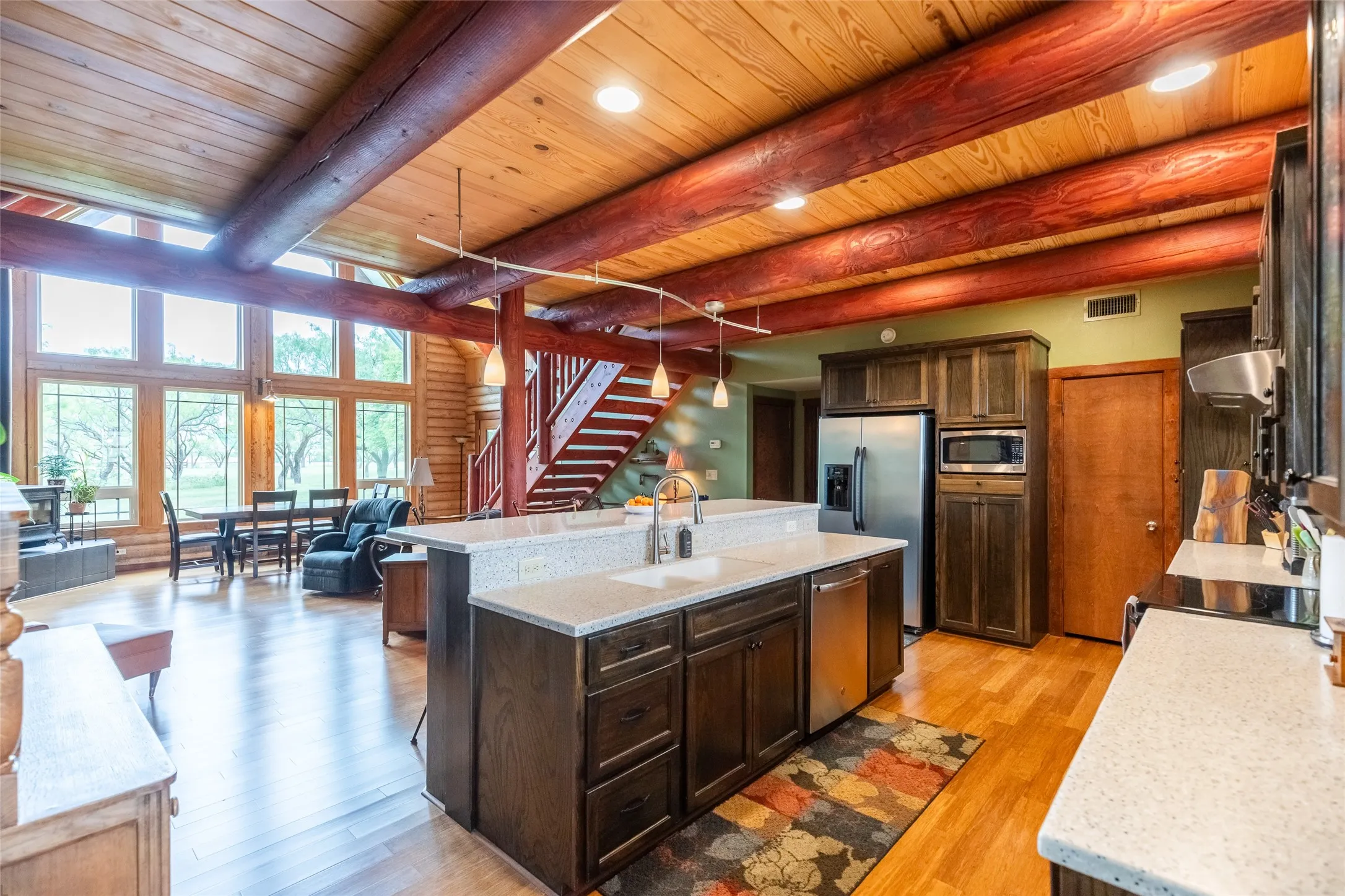 Dishwasher built in to the island is so convenient to the sink and all of the beautiful cabinetry. Thoughtful design and beautiful touches everywhere you look.
