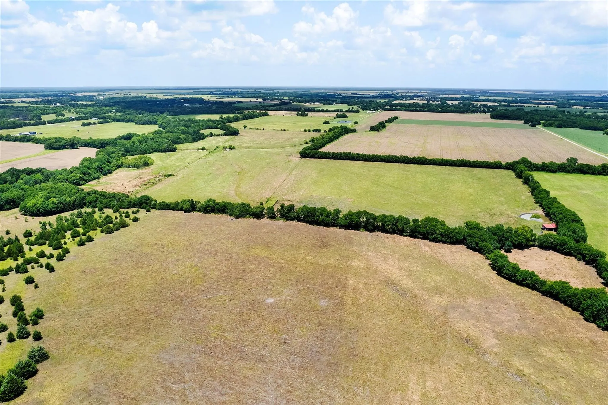 Cross fenced property with multiple ponds on site