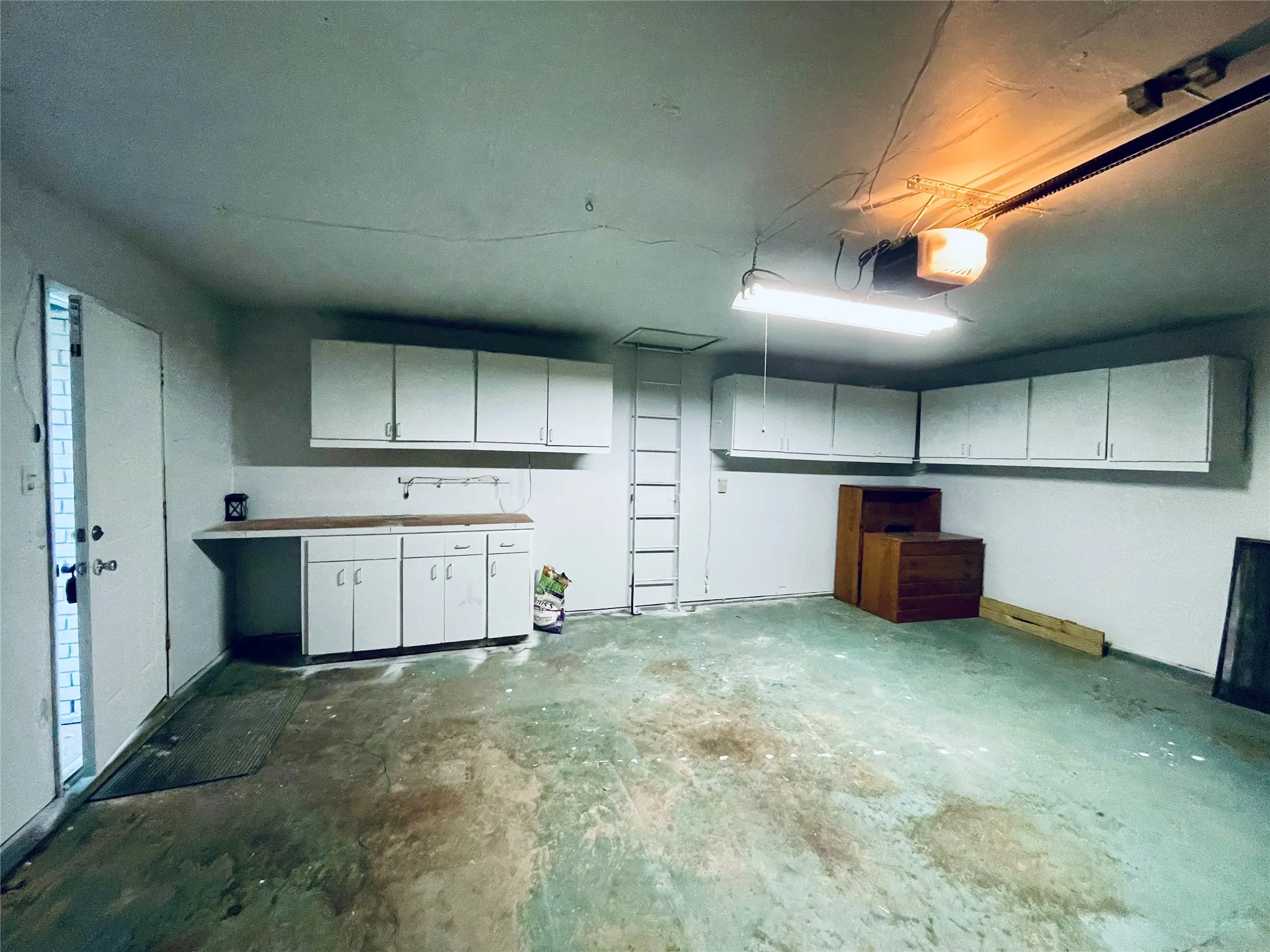 Garage featuring a garage door opener