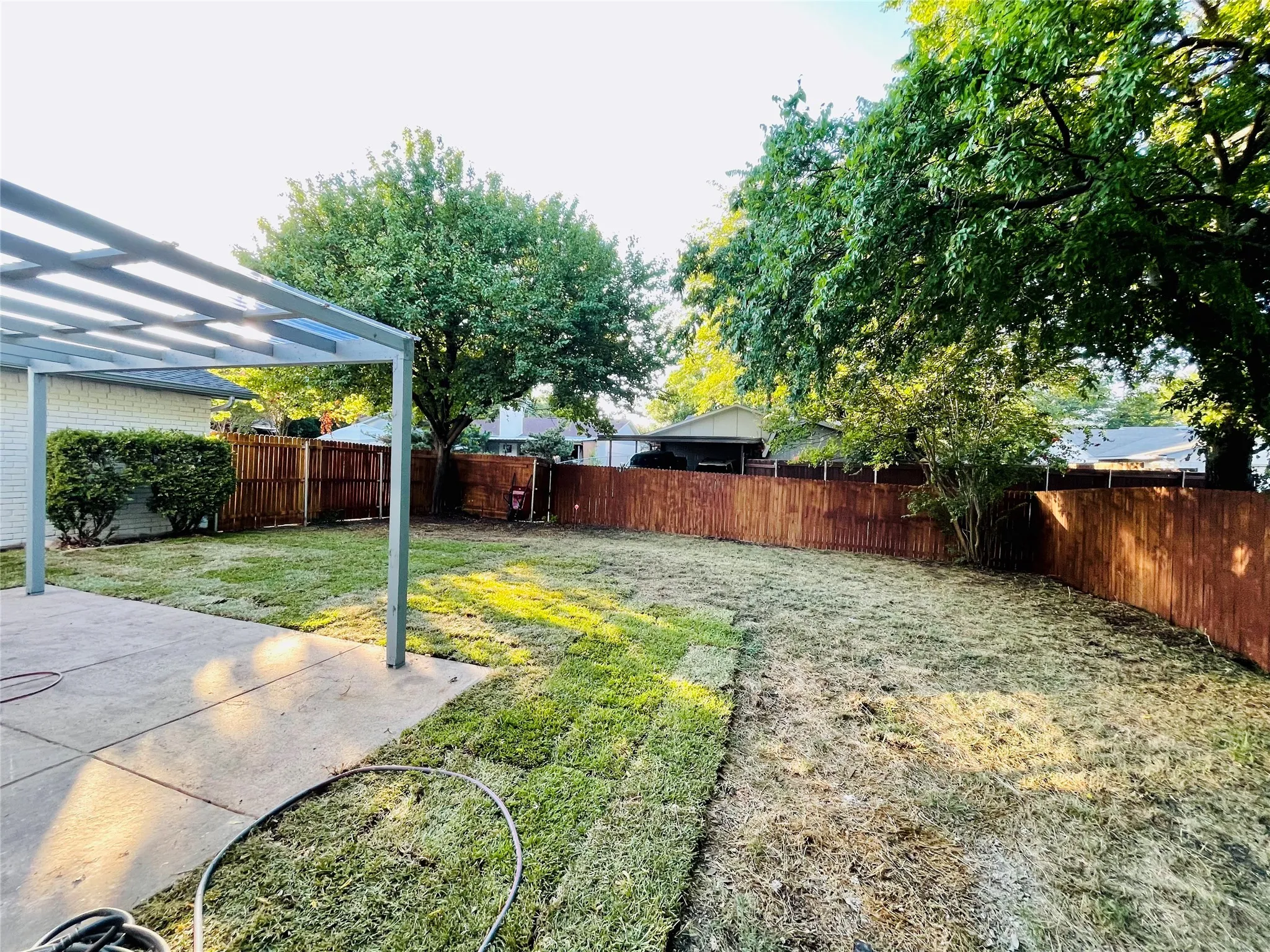 View of yard with a patio area and a pergola