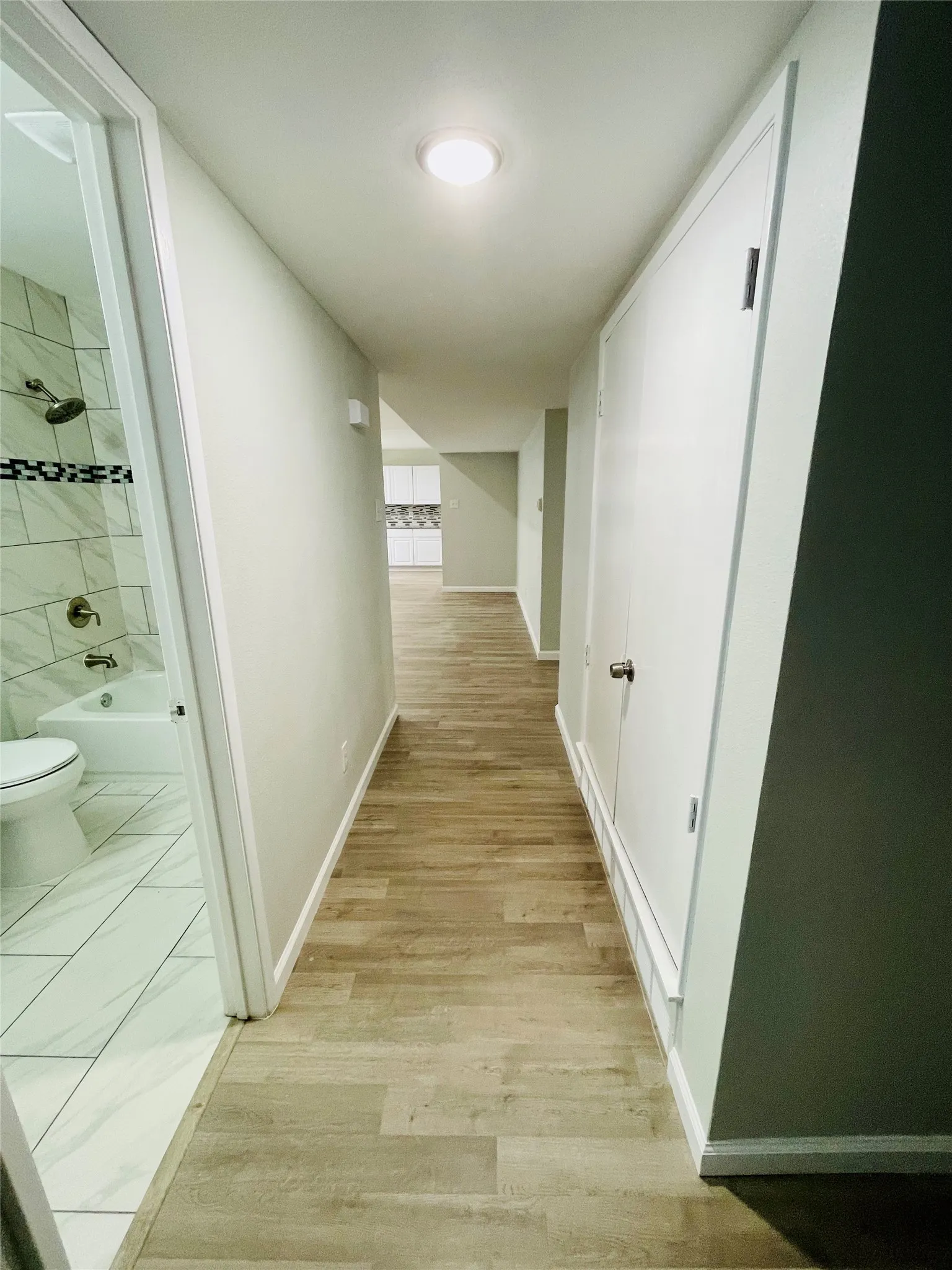 Hall with light wood-type flooring