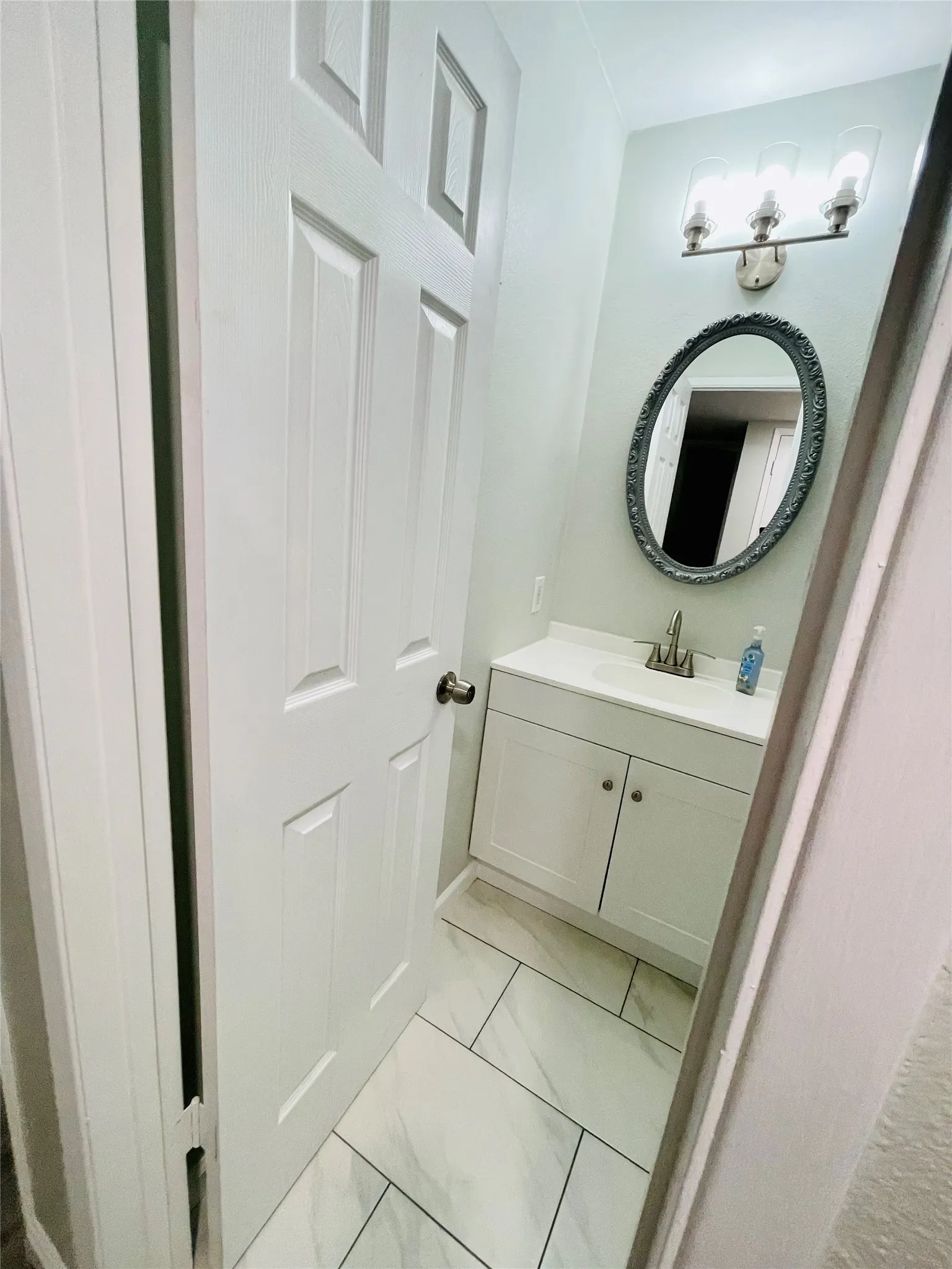 Bathroom with vanity and tile patterned floors