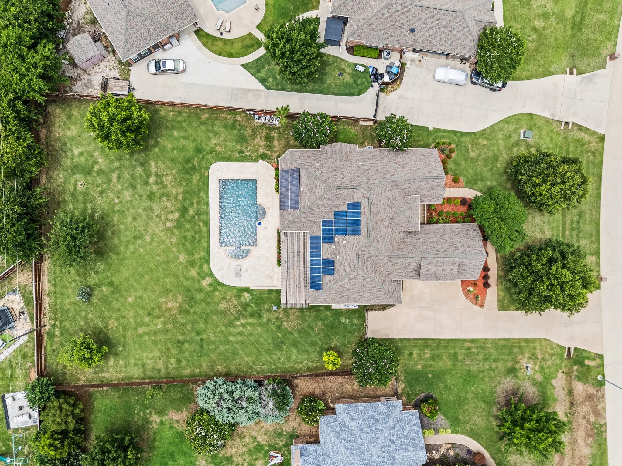 Treed, over half acre lot with beautiful pool and spa, oversized driveway and 3 car garage. Solar panels are bought and paid for so you can enjoy all the benefits without any of the costs.