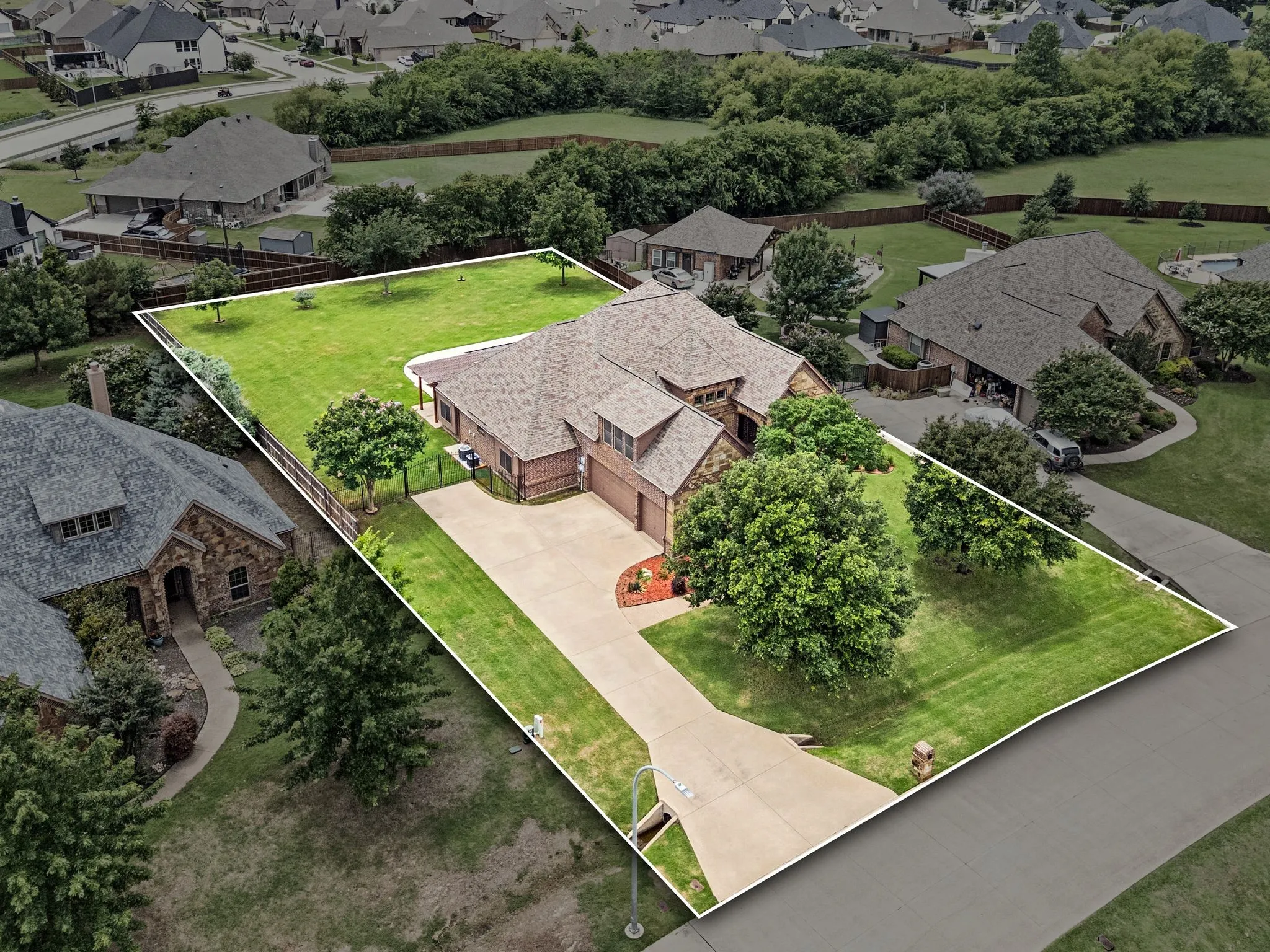 Nestled within a quiet neighborhood and seated on over a half acre with trees and a full yard programmable sprinkler system.