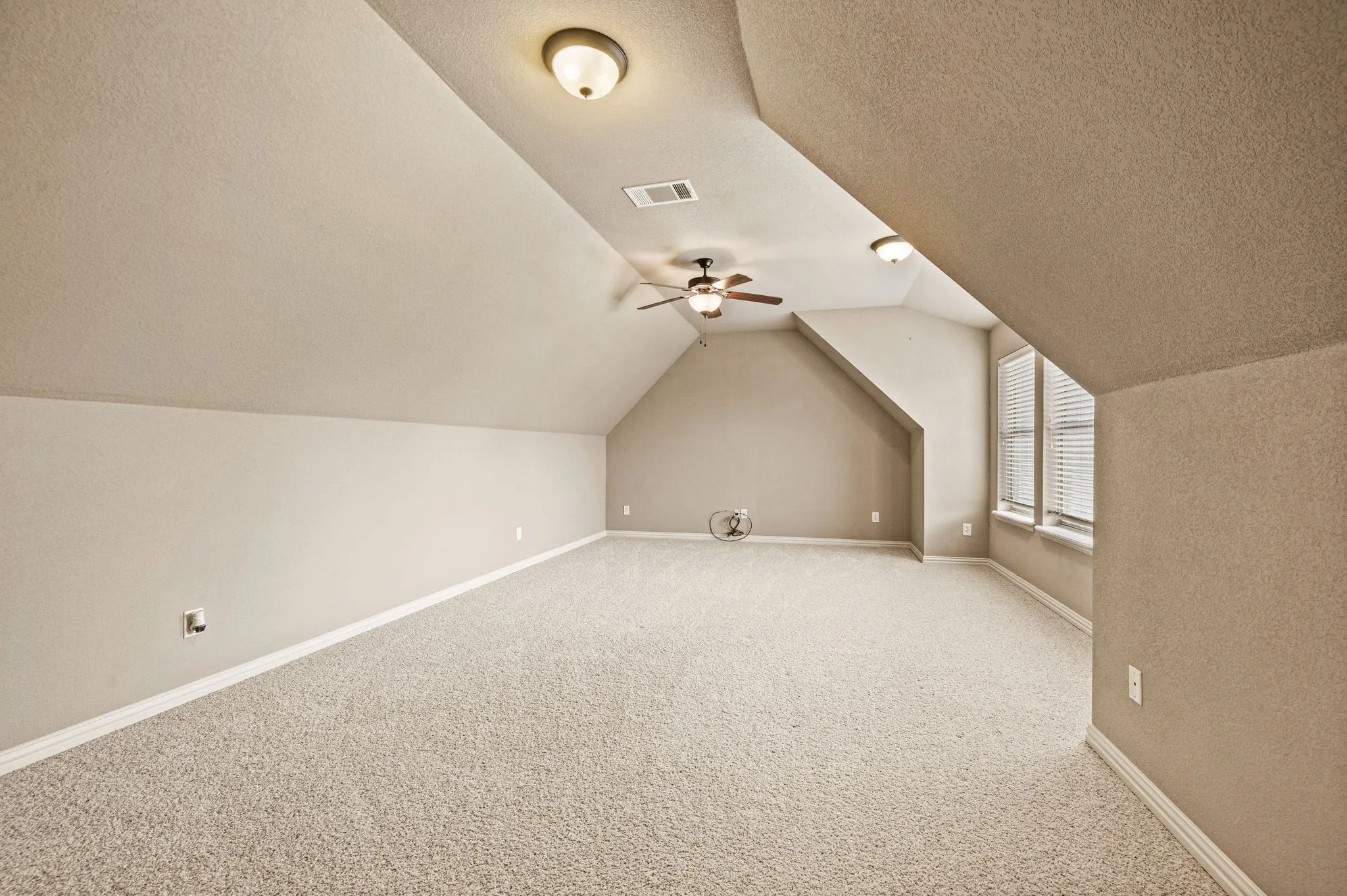 This upstairs bonus room is ready for any activity; game, media, exercise or craft space. You name it!