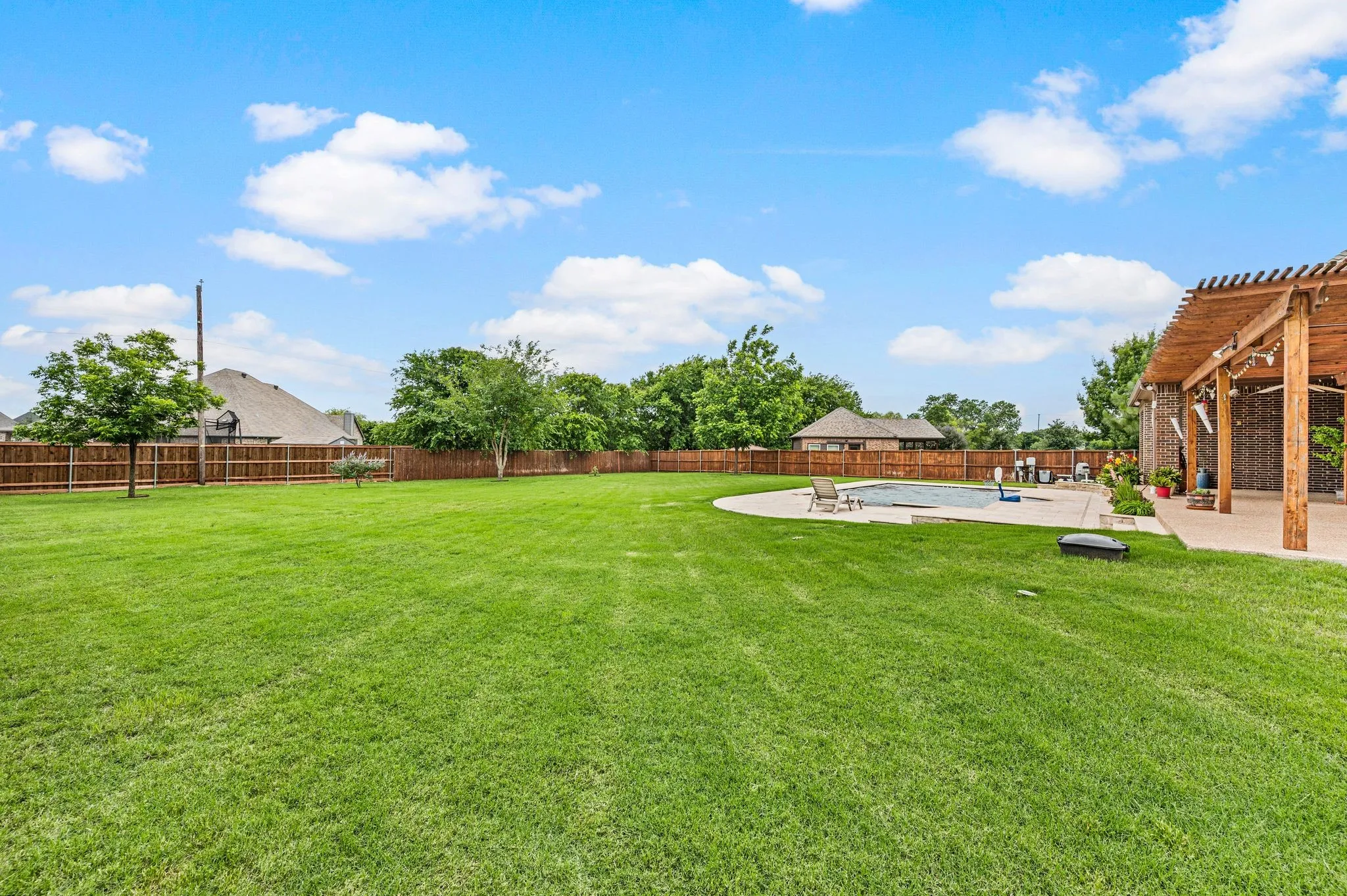 This property has over a half acre and the backyard is fully fenced with six foot stained cedar panels and metal posts.