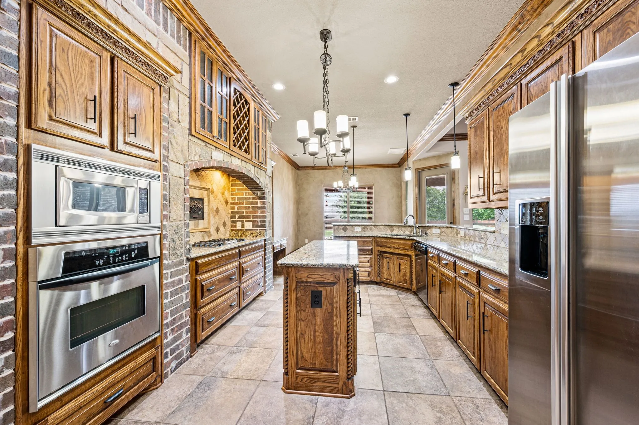 Stainless steel appliances include a refrigerator, built in oven and microwave.