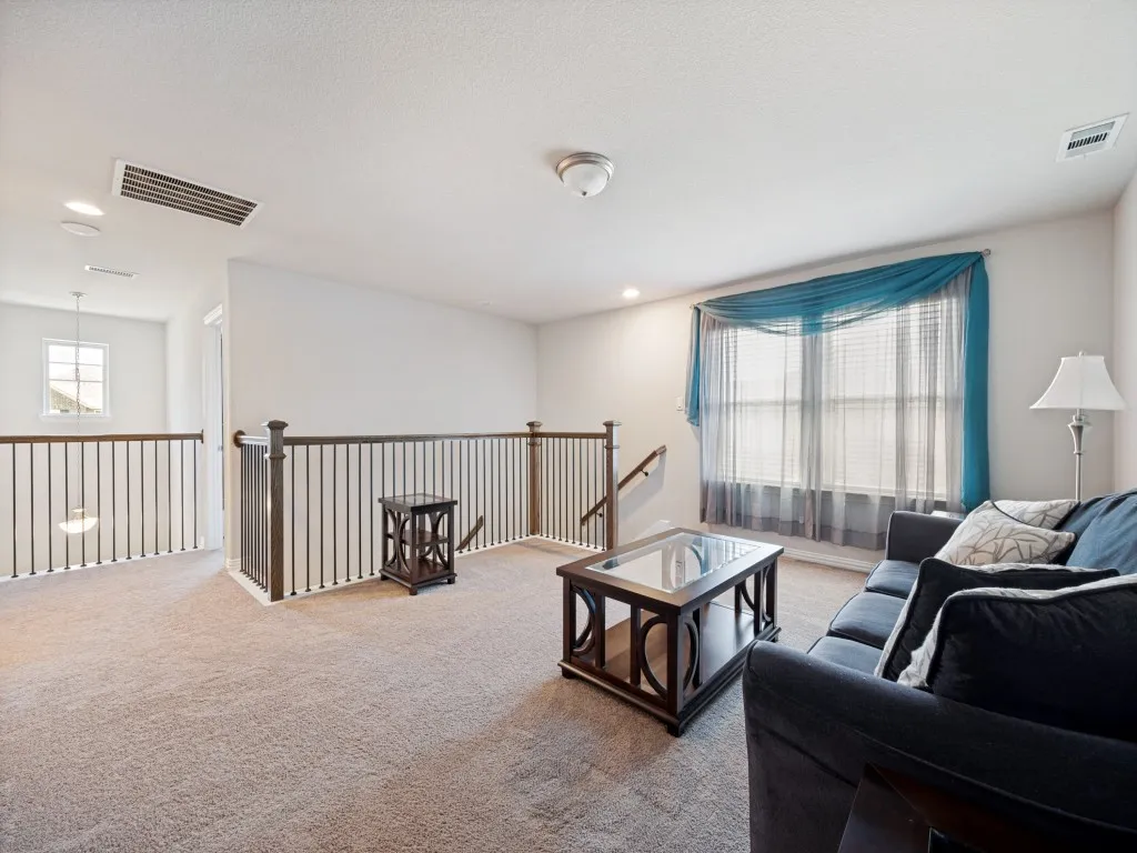 Carpeted loft area can be used as a game room or what ever flows with the theme of your home.