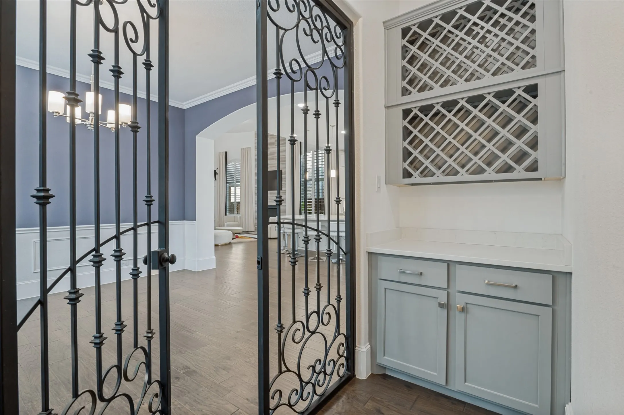 Wine room off of dining room that curves under the stairs