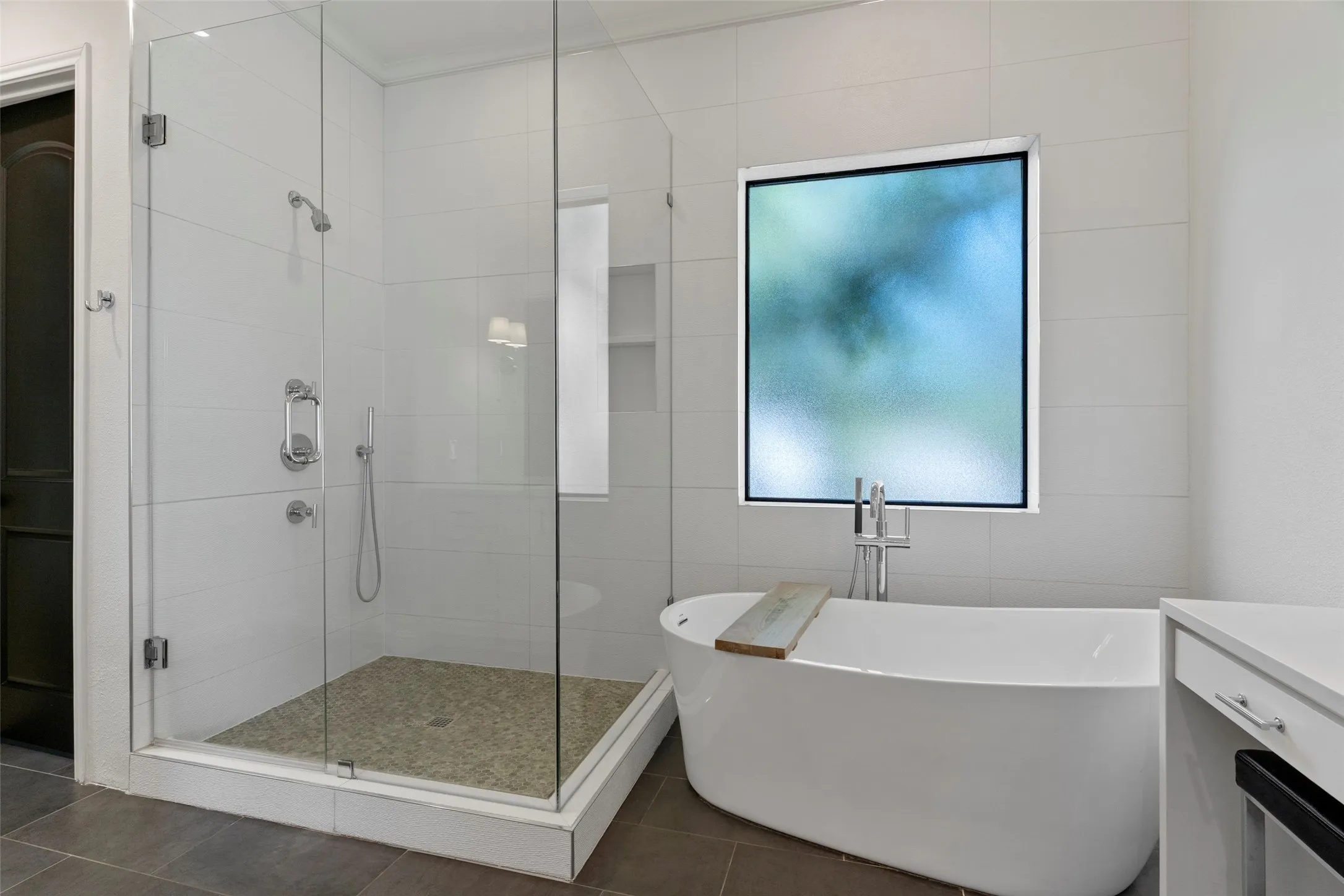 Primary Bathroom w frameless shower and free-standing tub