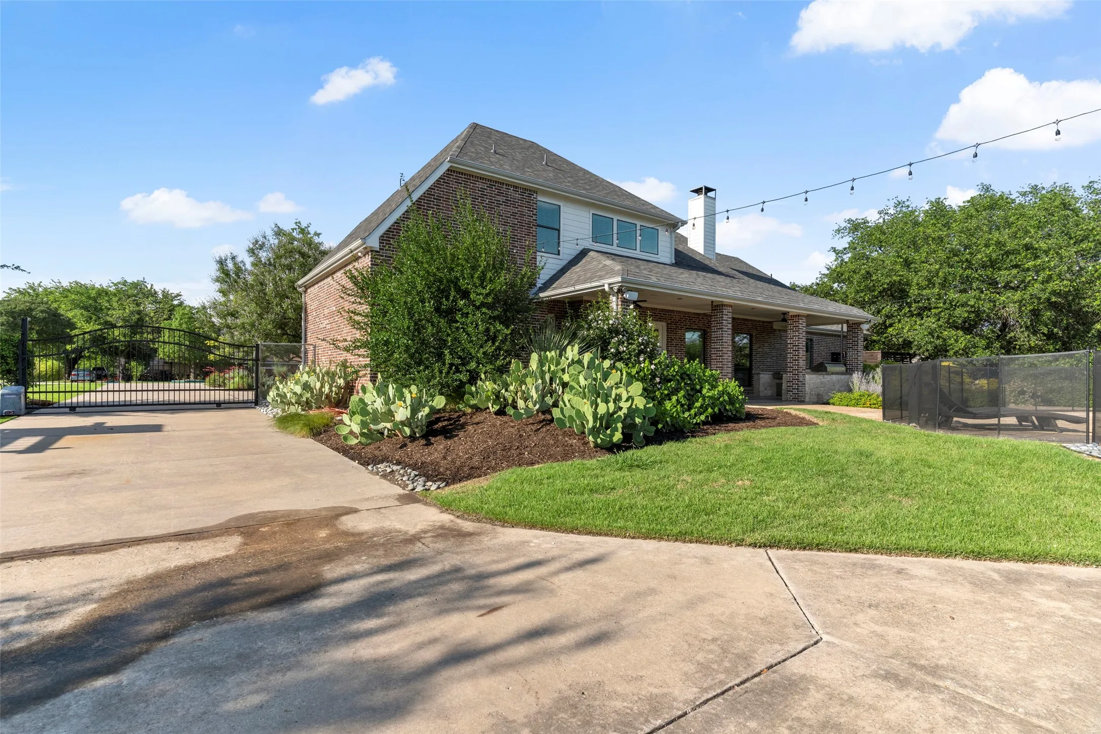 Rear yard with gate at the driveway