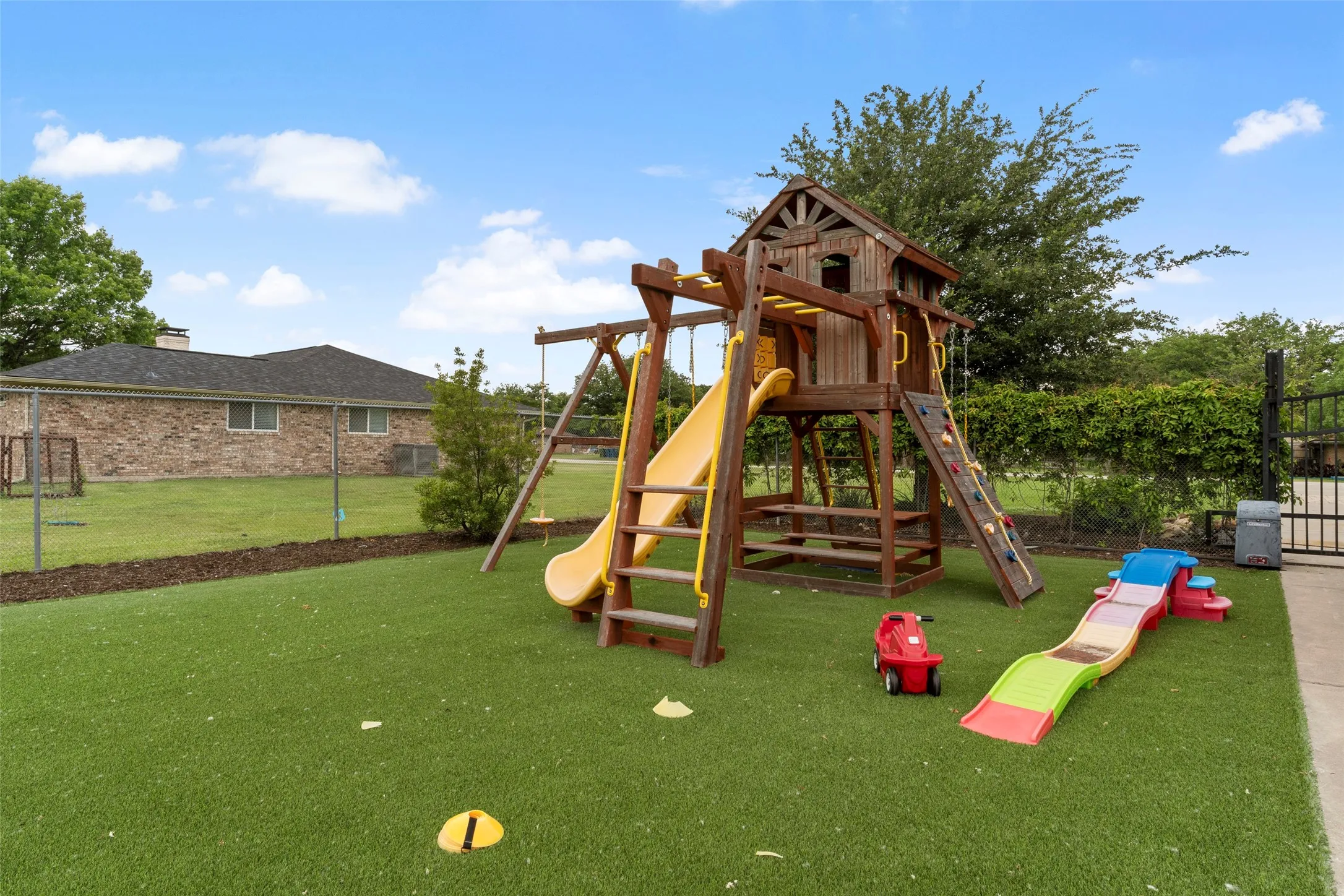 Side yard with turf and playset