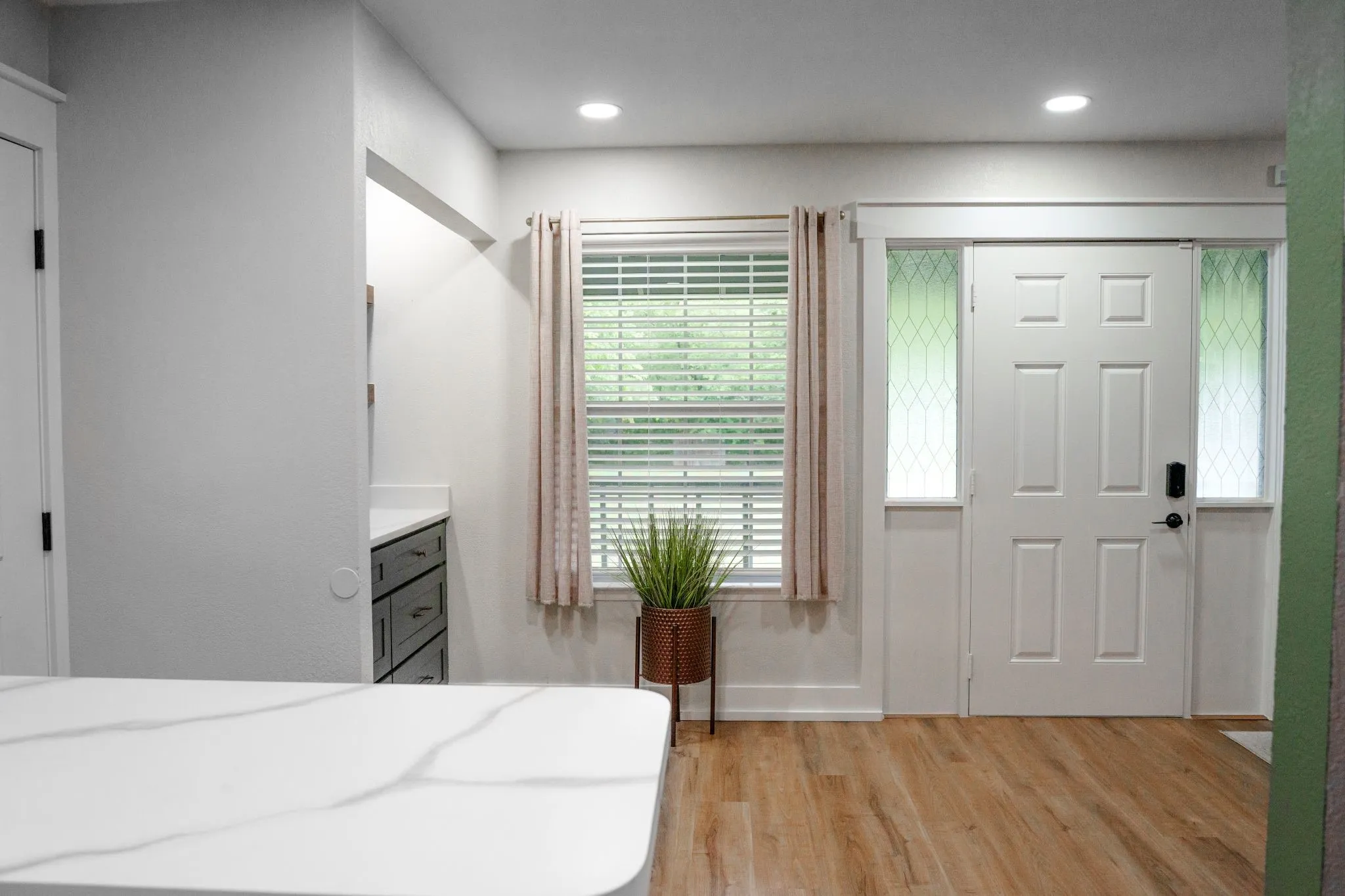 Great open space to entertain near the kitchen or move the party to the backyard.