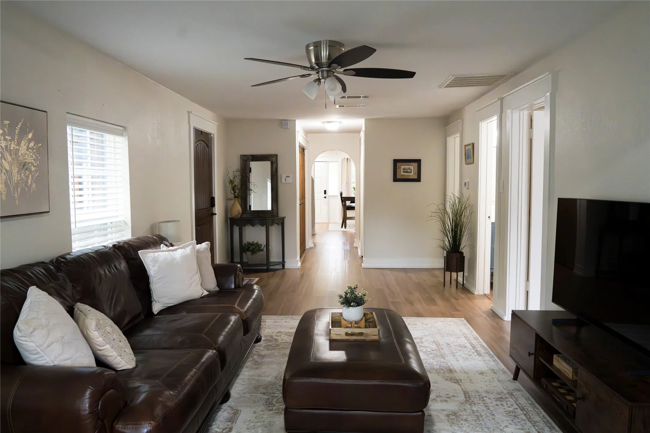 Large but cozy living room is a perfect place to host friends and family.