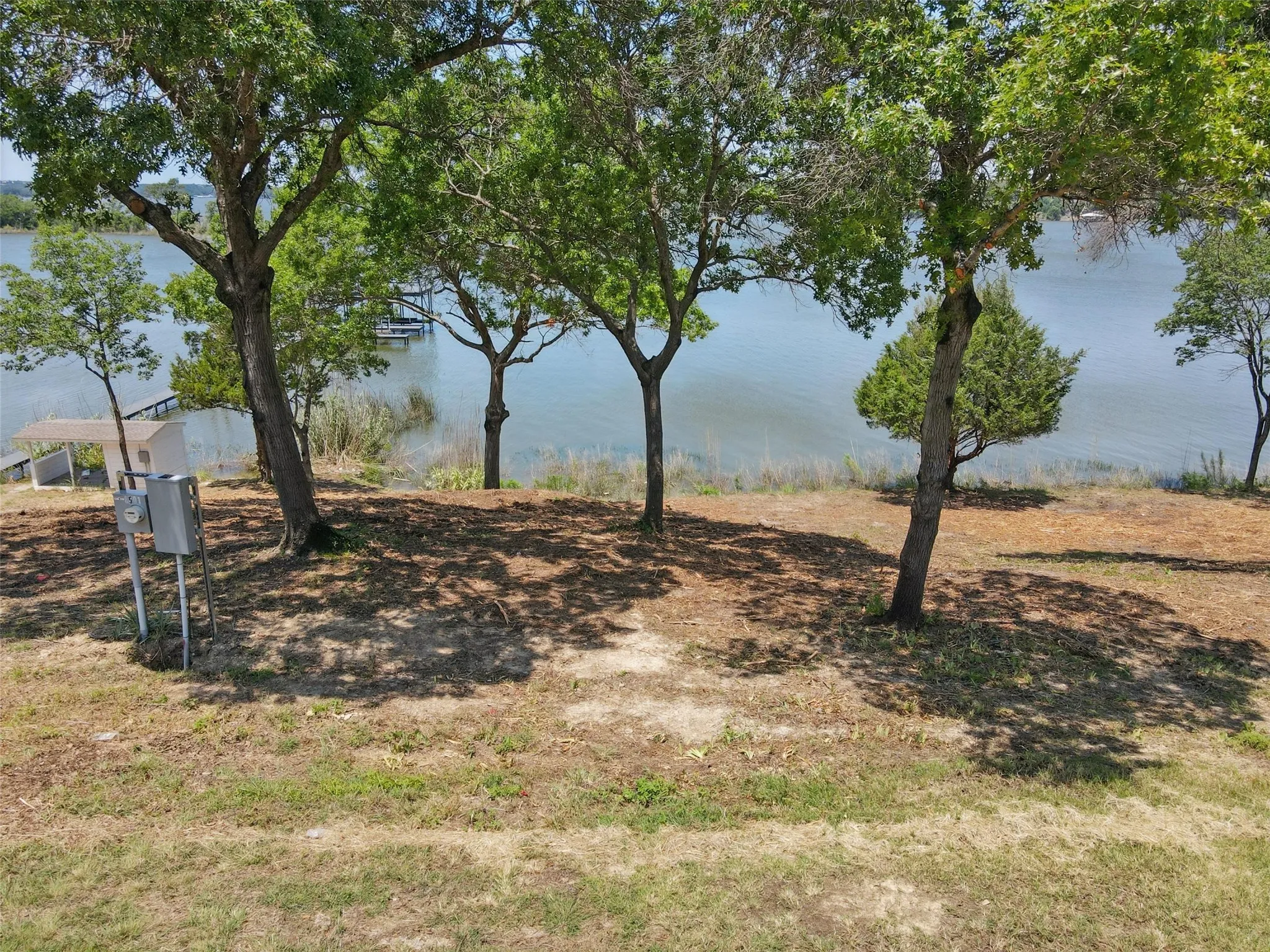View of yard with a water view