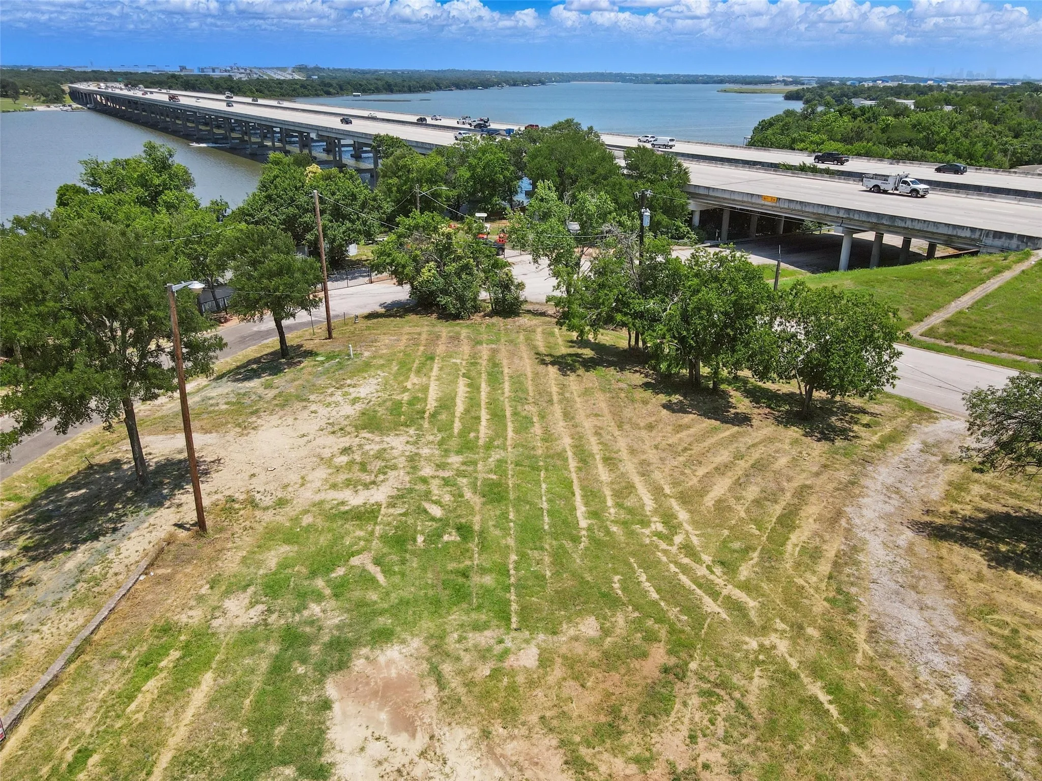 Aerial view of a nearby body of water and a notable bridge