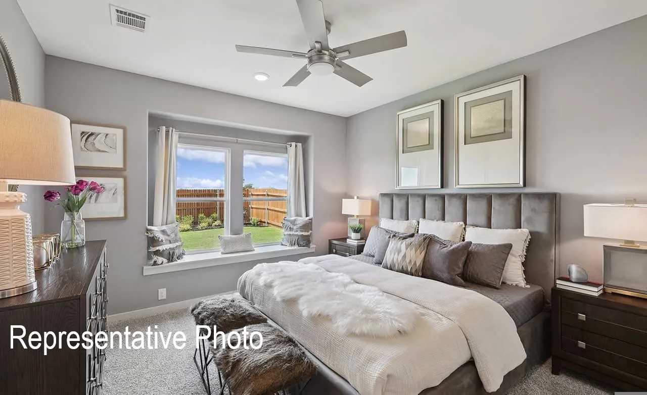 Bedroom featuring a window seat with outdoor views, recessed lighting, and a ceiling fan