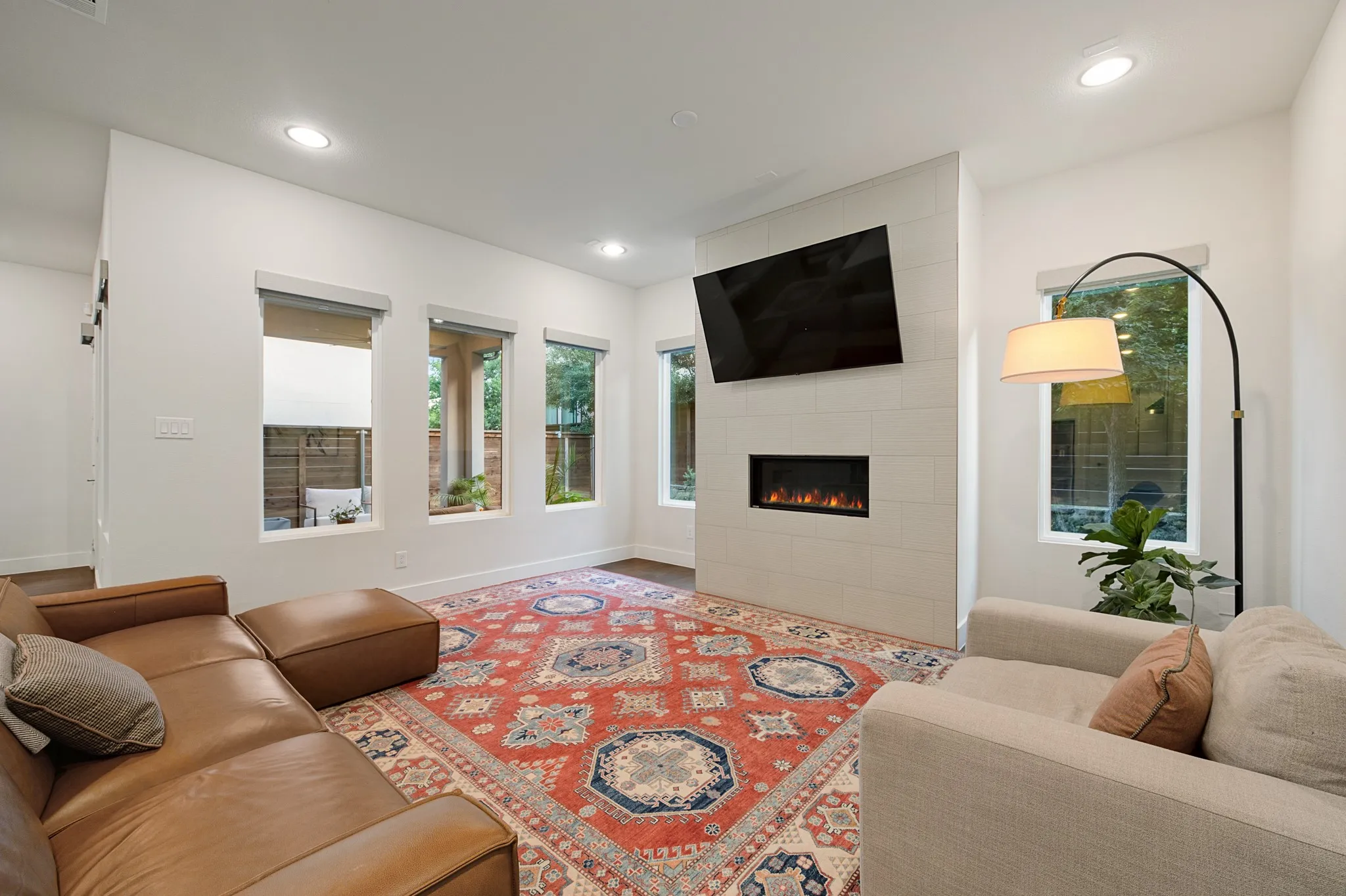 Cozy living room with plenty of windows.