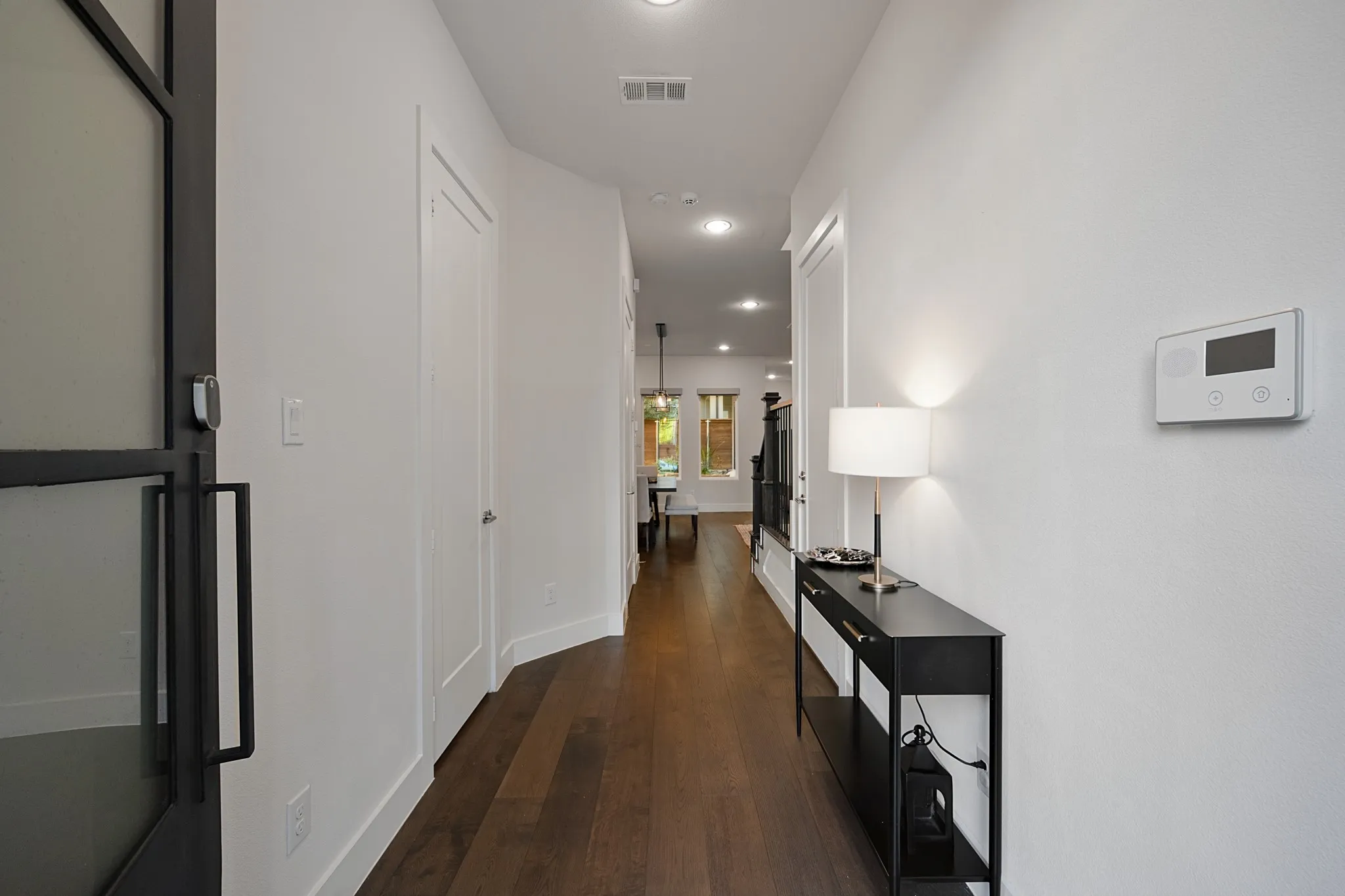 Long entryway to the kitchen and living area.