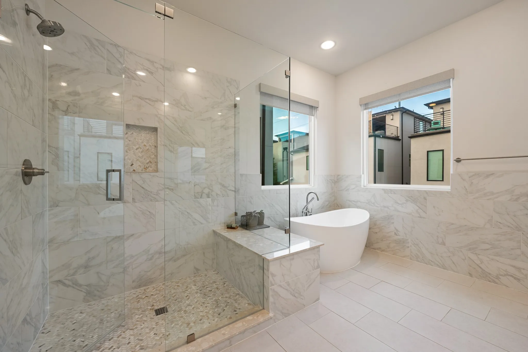 Spa inspired primary bath with standalone tub and large walk-in shower.