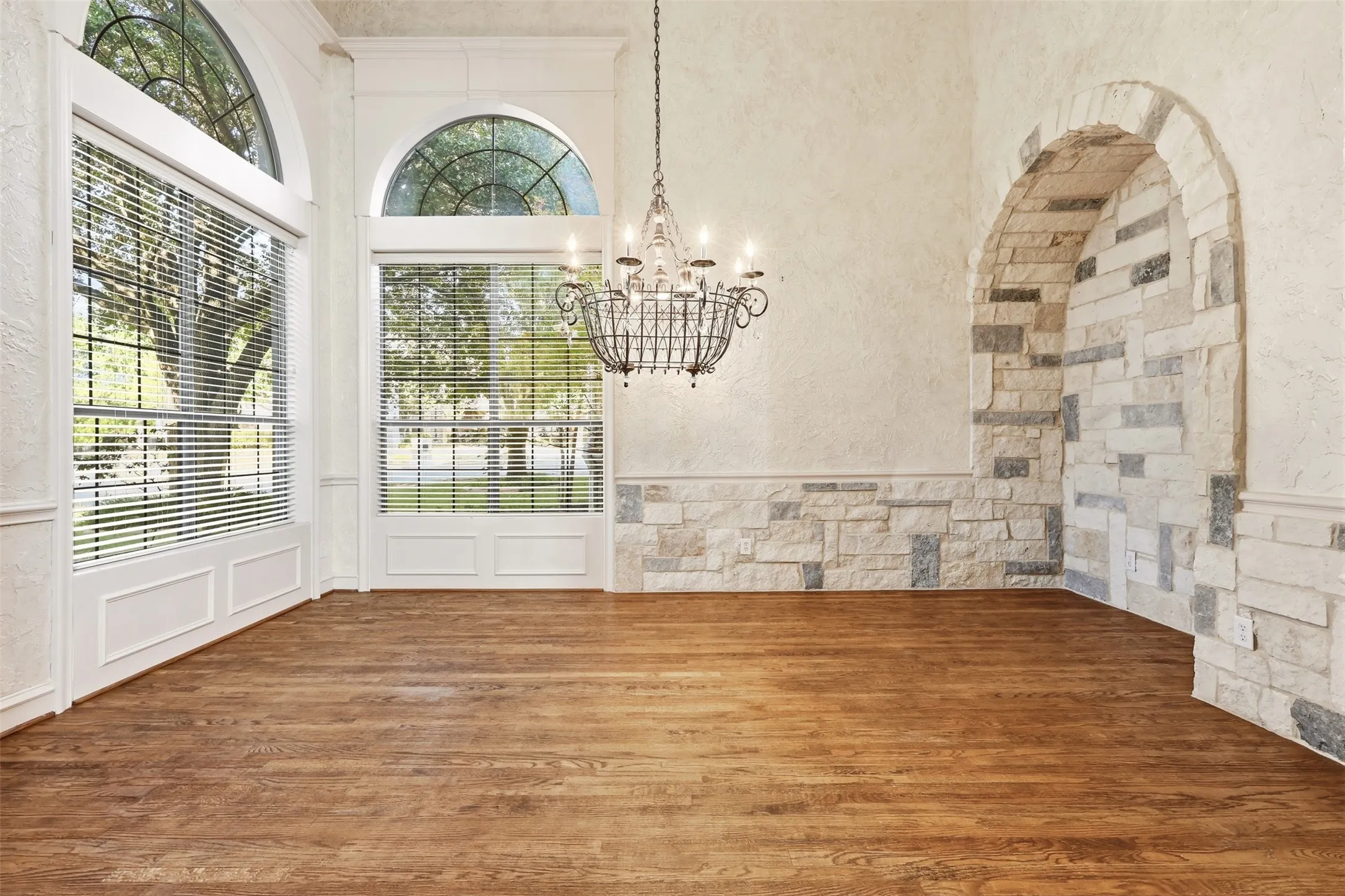 Hand scraped wood floors and custom stone enhancements