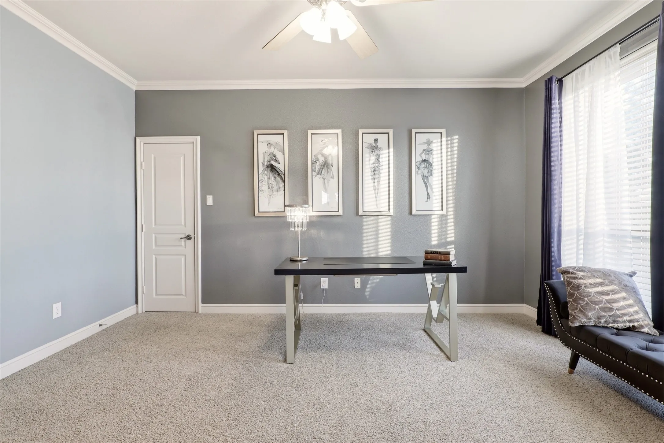 Crown molding, ceiling fan, white trim, light-colored carpeting, and a window with blinds