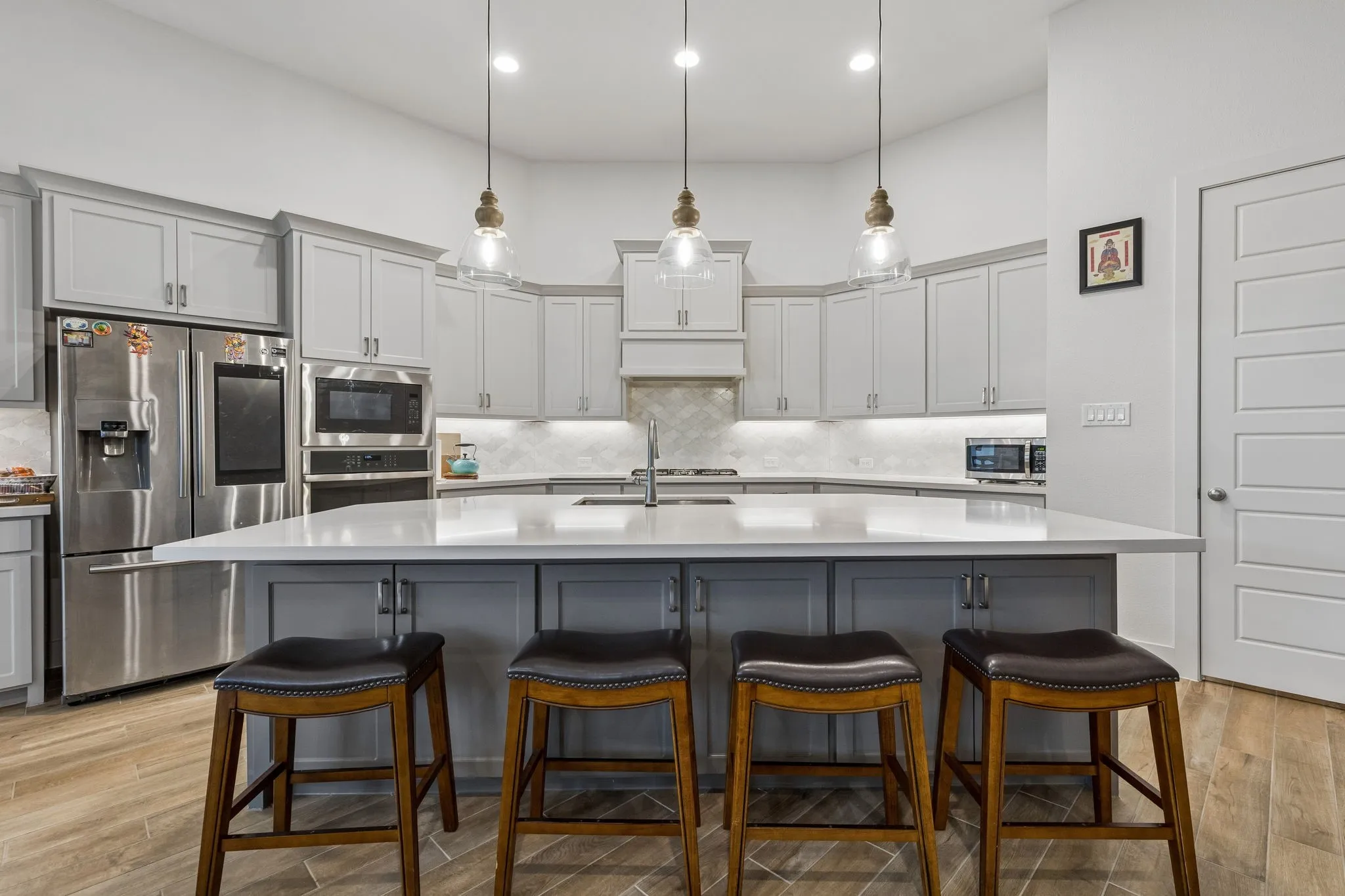 Expansive kitchen island with a light-toned countertop