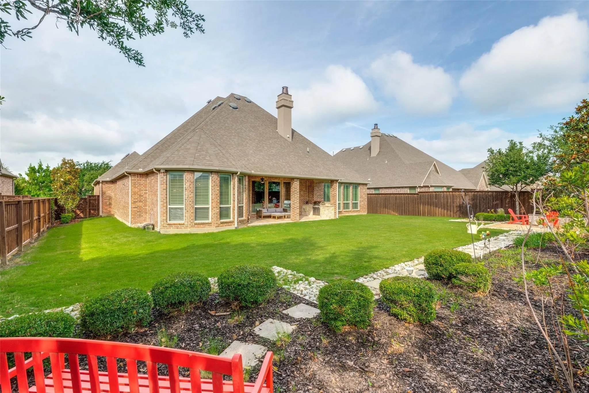 One of the standout features of this exceptional home is the expansive backyard oasis, offering an abundance of space rarely found within the prestigious gated section of The Tribute. The oversized homesite provides endless possibilities for outdoor living, a play area or simply enjoying the wide-open green space. Meticulously maintained landscaping, mature trees, and thoughtfully designed garden beds create a picturesque setting, while the fully fenced yard offers both privacy and security.