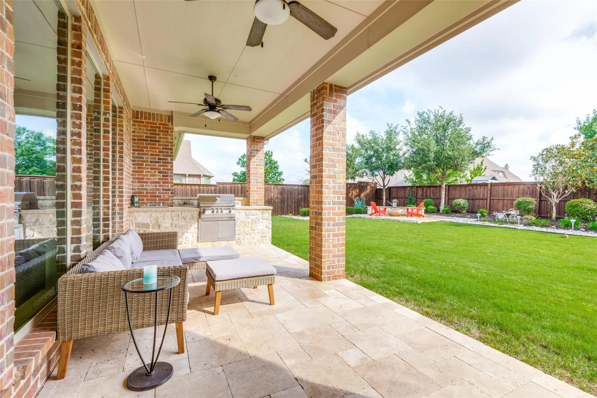 Designed for year-round enjoyment, this expansive covered patio creates the ultimate outdoor living and entertaining space. The generous layout offers plenty of room for comfortable seating and dining areas, while dual ceiling fans provide added comfort during warm Texas evenings. A fully equipped outdoor kitchen with built-in grill and serving bar makes hosting family gatherings, cookouts, and game-day celebrations​​‌​​​​‌​​‌‌​‌‌​​​‌‌​‌​‌​‌​​​‌​​ effortless.