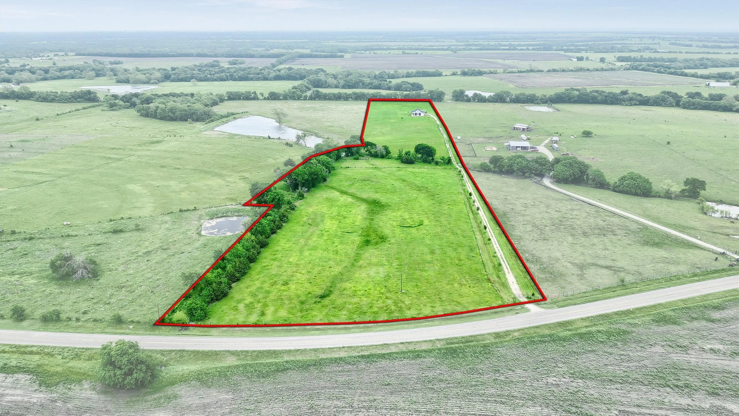 This is an Outlined Aerial View of property from the county road
