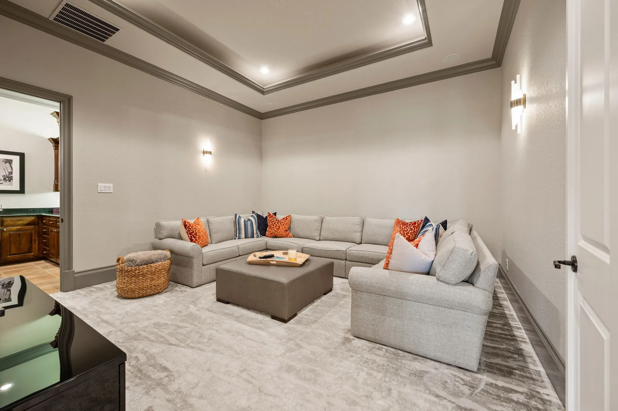 The media room is located on the main level & connects to the wet bar and billiard room on the other side.
