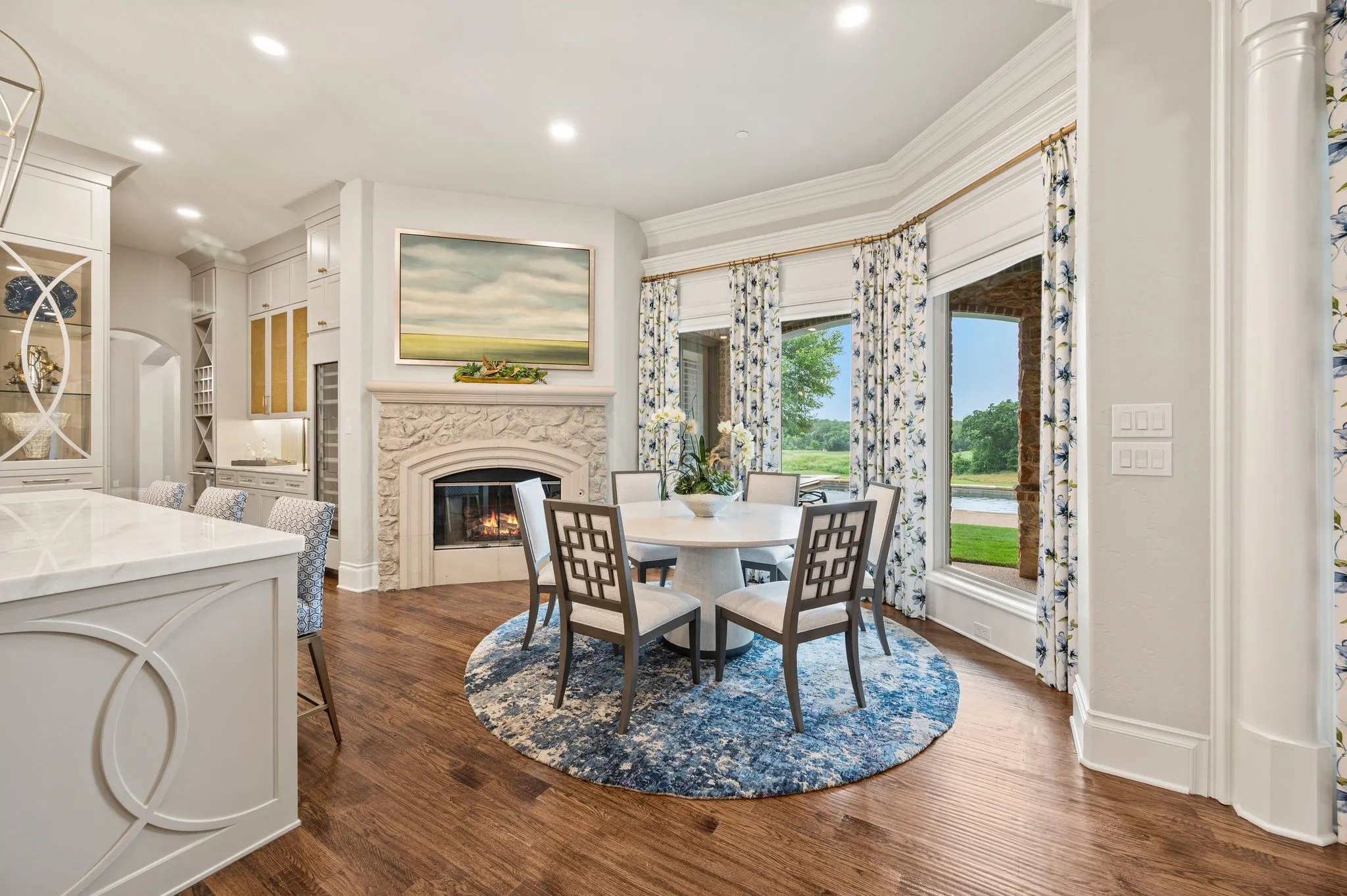 The charming breakfast nooks offers a cozy, gas fireplace,  and the prettiest sweeping views of the golf course.
