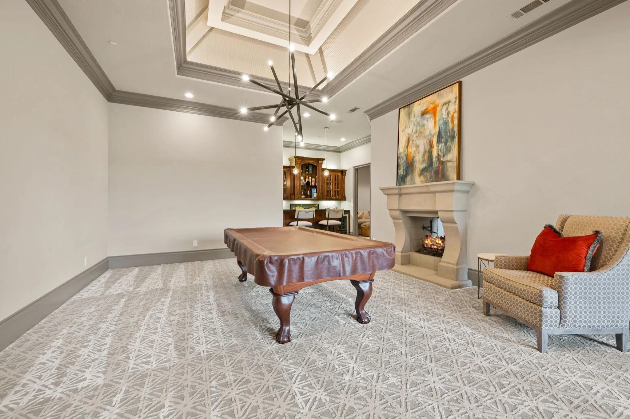 First floor billiard room - pool table included! Note wet bar at the back!