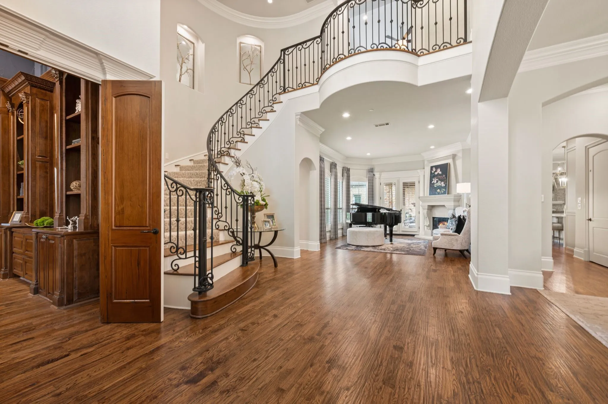 The curved staircase & elegant lighting will impress you upon entering the main foyer.