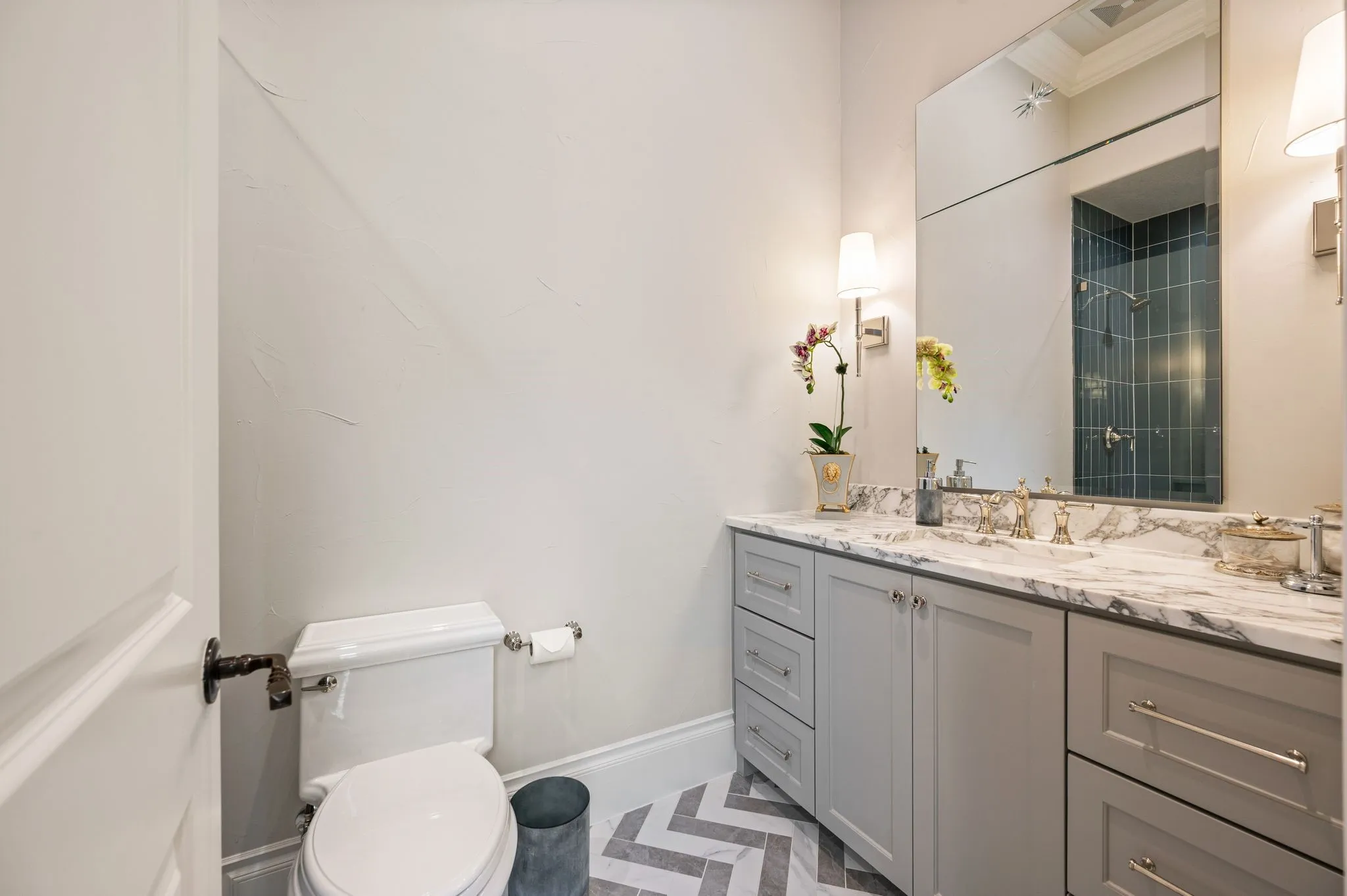 Full bath serving the first floor guest bedroom.