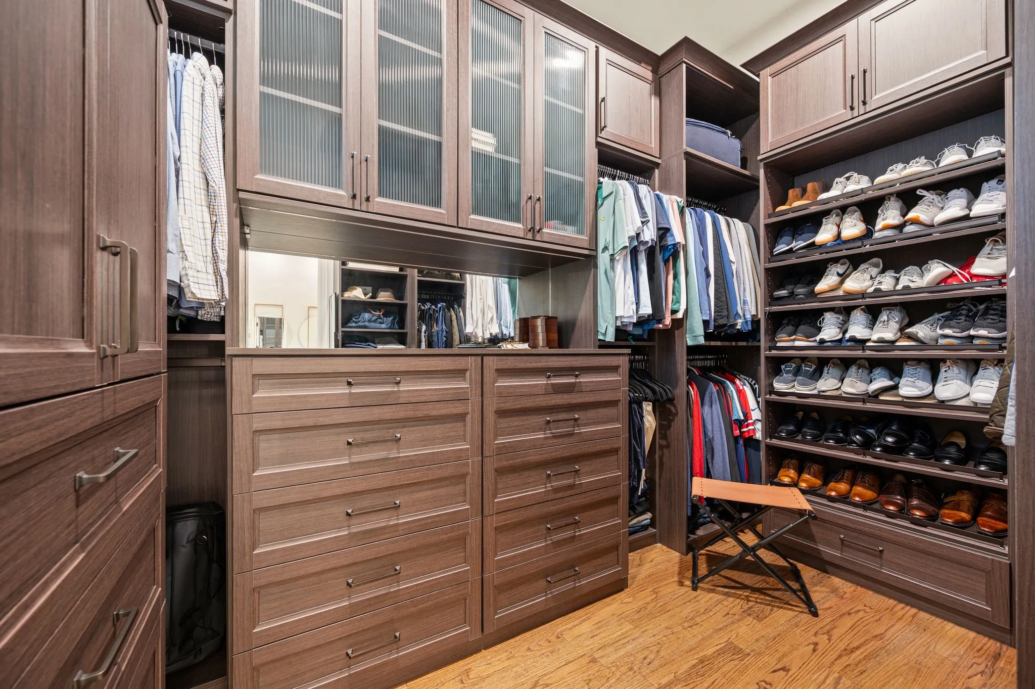 A second primary closet, also customized by Closet Envy.