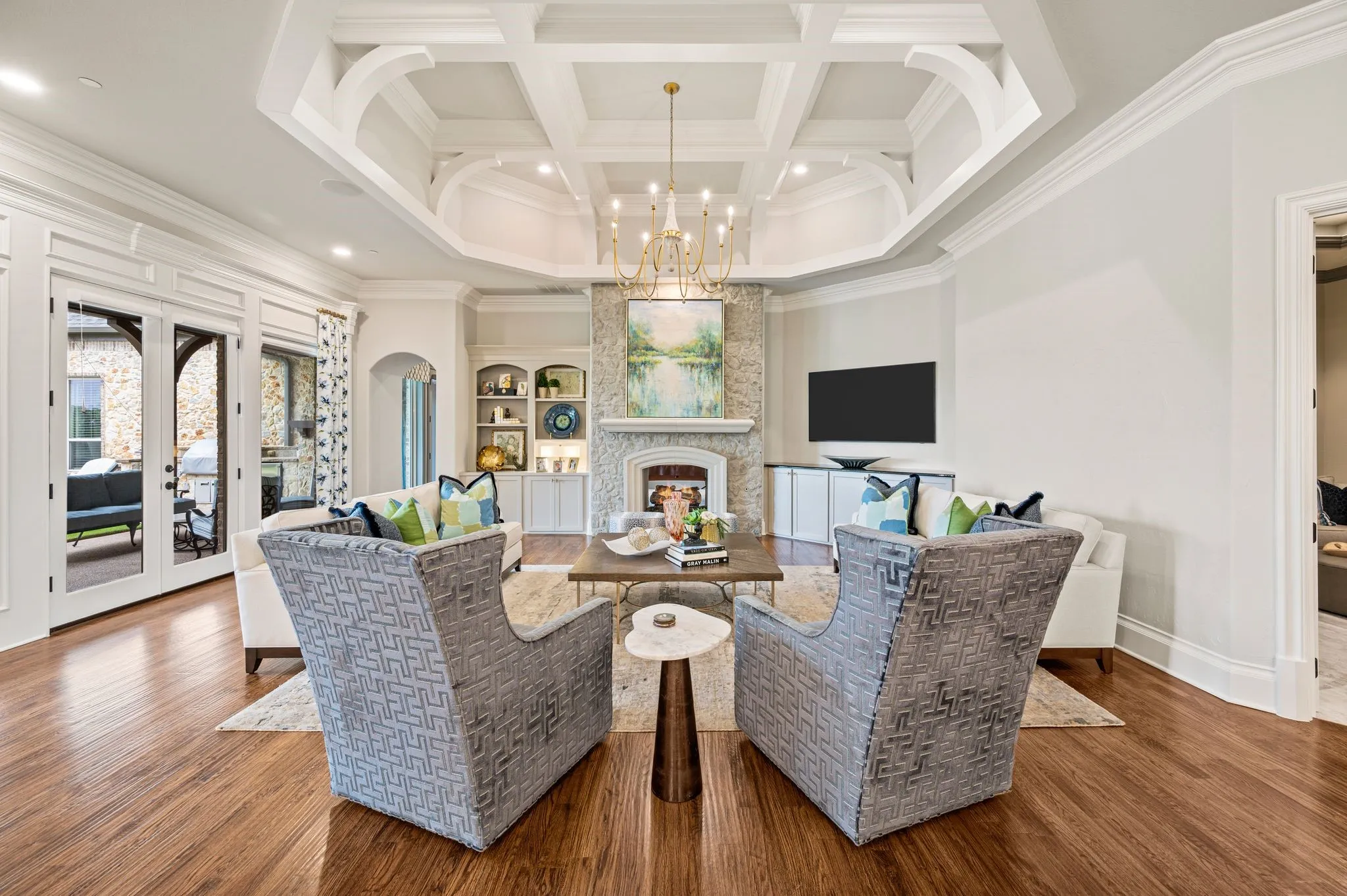 One of many impressive ceiling treatments in the home includes the family room's coffered ceiling.