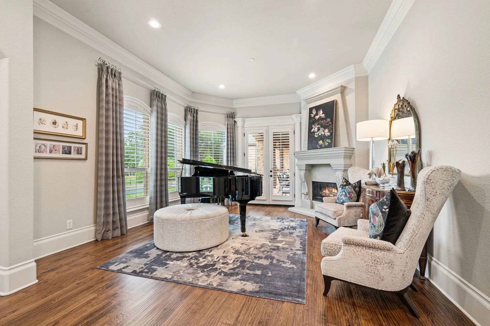 The formal living features a gas fireplace and views of the pool area. A perfect quiet space!