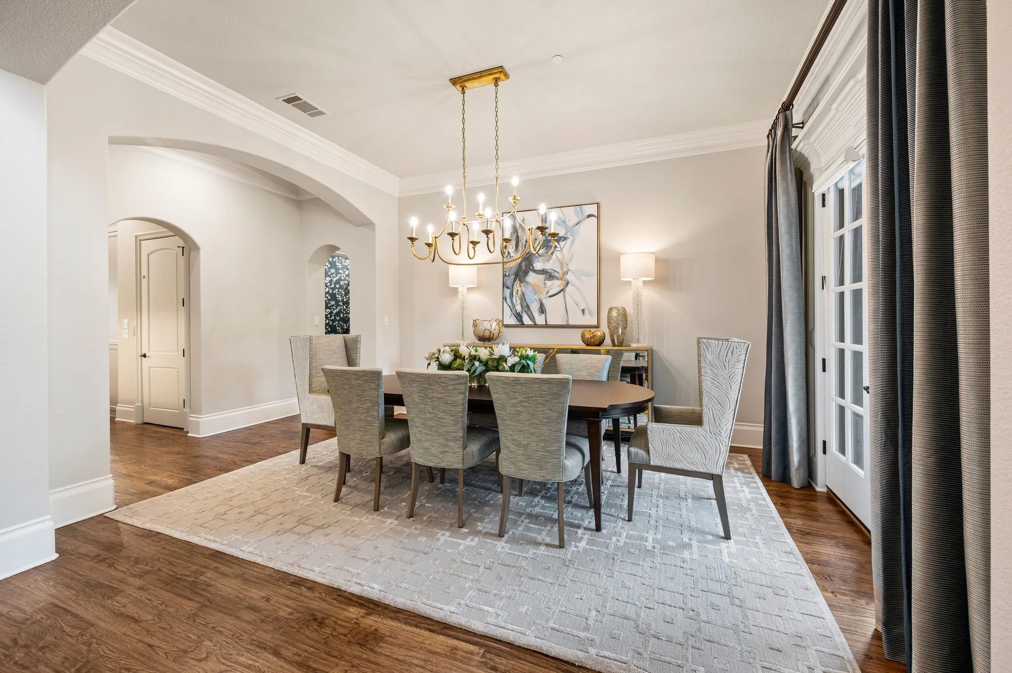 The formal dining is  located off the main foyer. French doors overlook the front porch.