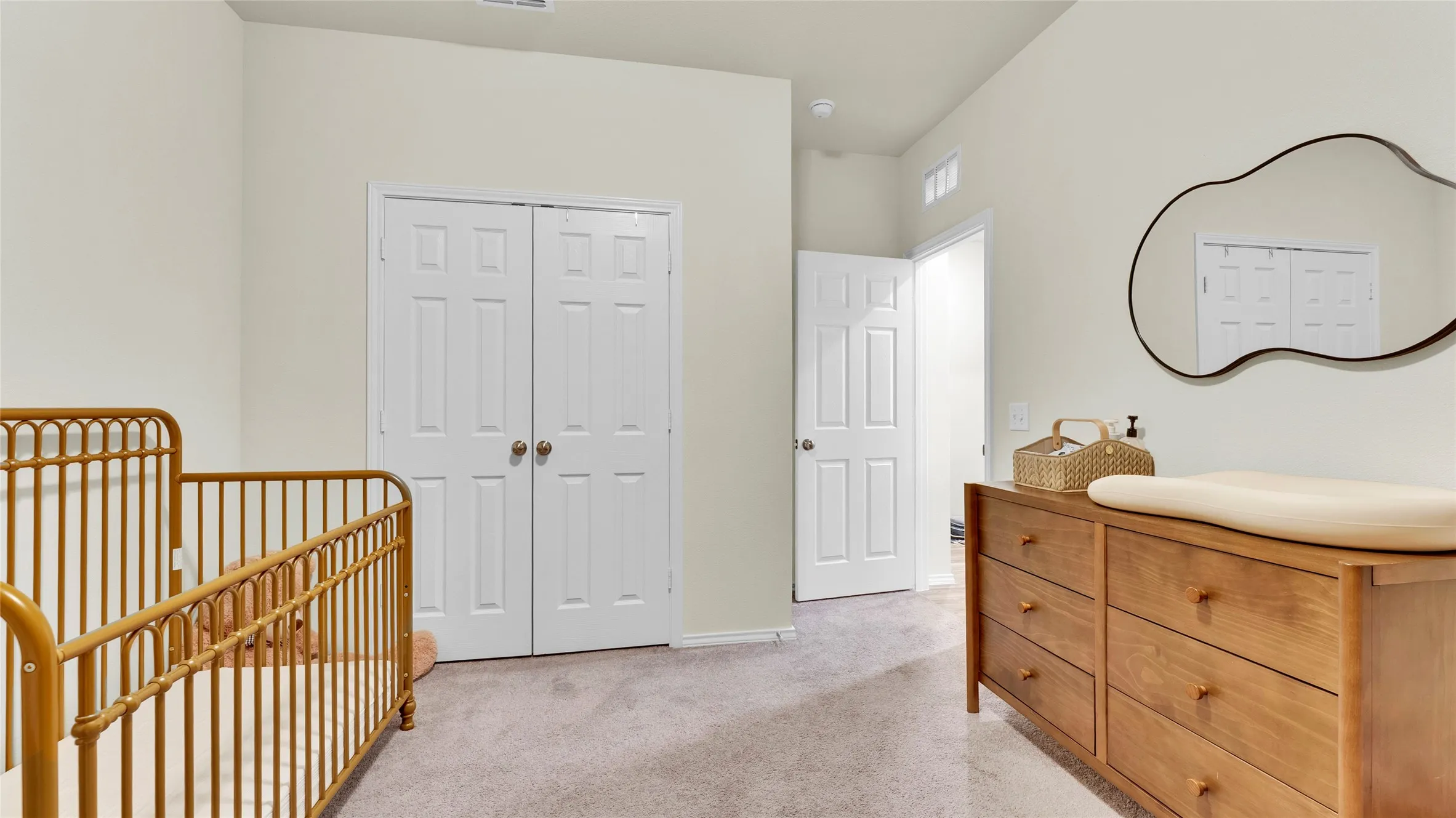 Carpeted room with light-colored walls