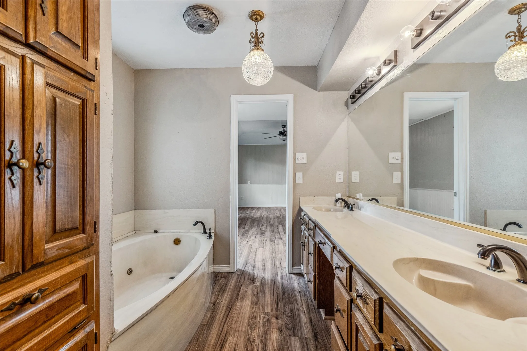 Double vanity with integrated sinks, ample countertop space, and oil-rubbed bronze fixtures
