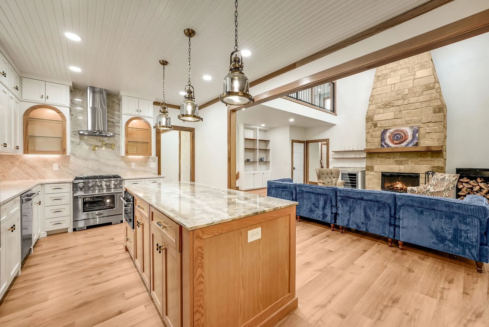 Open-concept kitchen and living area featuring wood-finish flooring