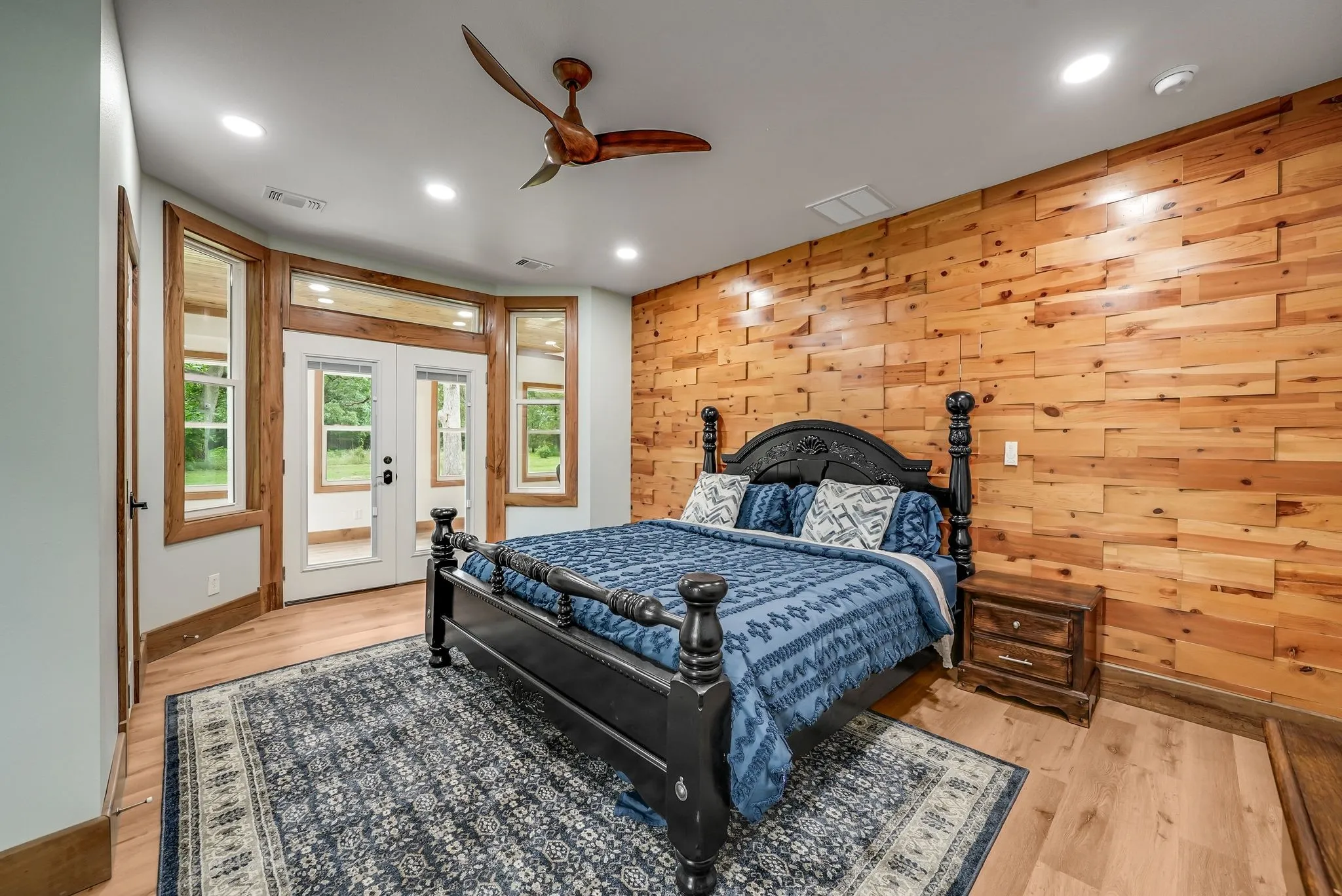 Accent wood-paneled wall complementing wood-finish flooring